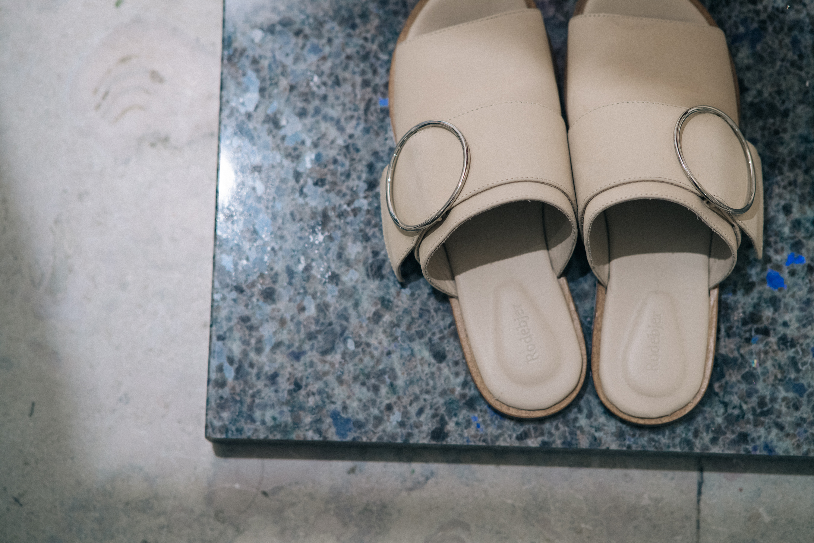 Pair of white leather slippers