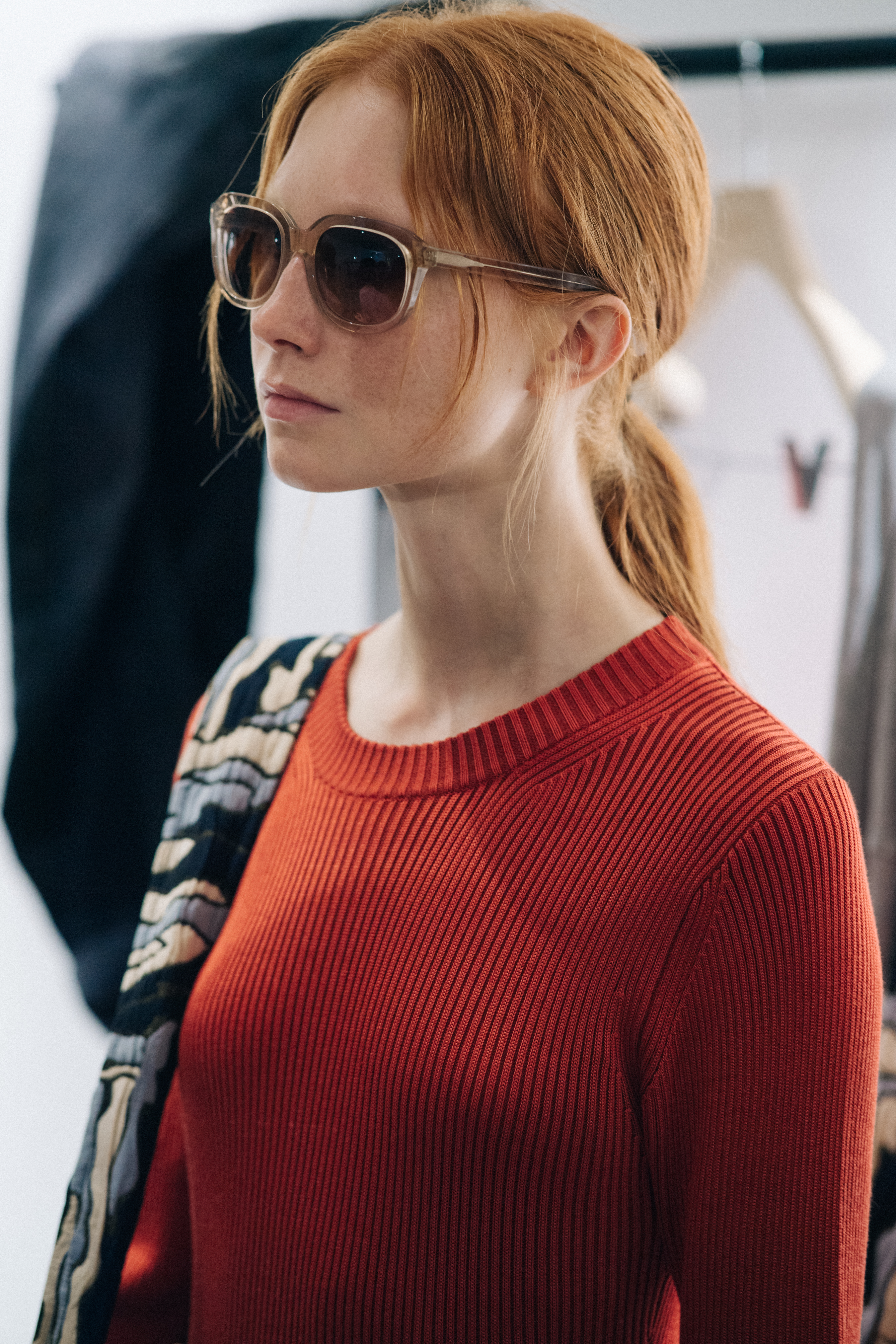 Model wearing red sweater
