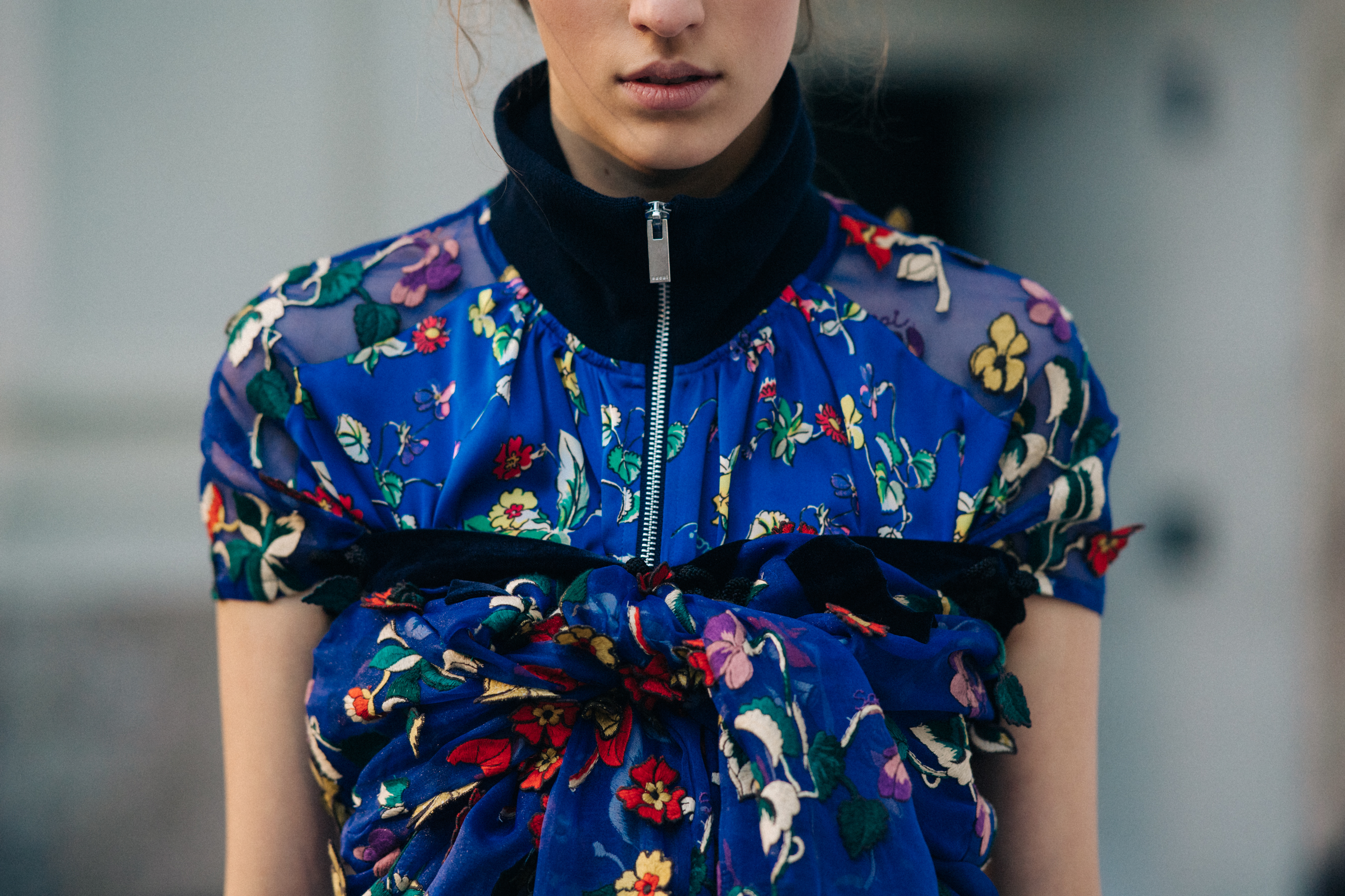 Model wearing floral dress before a show