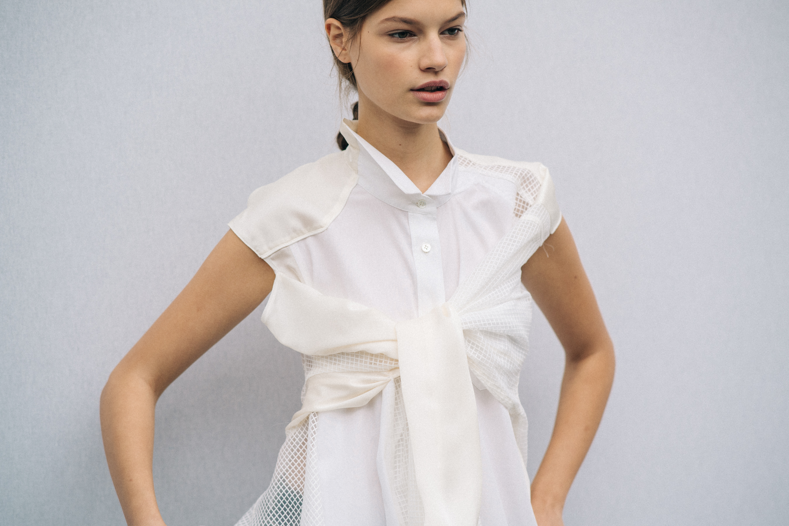 Model wearing white outfit