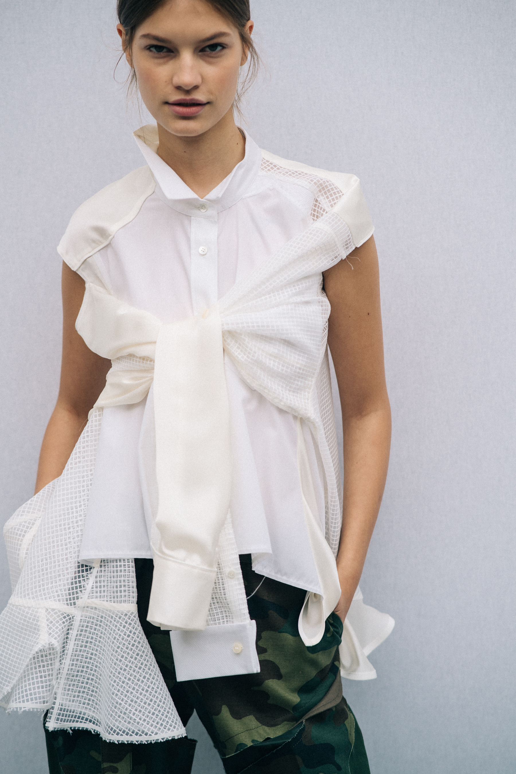 Model wearing white outfit