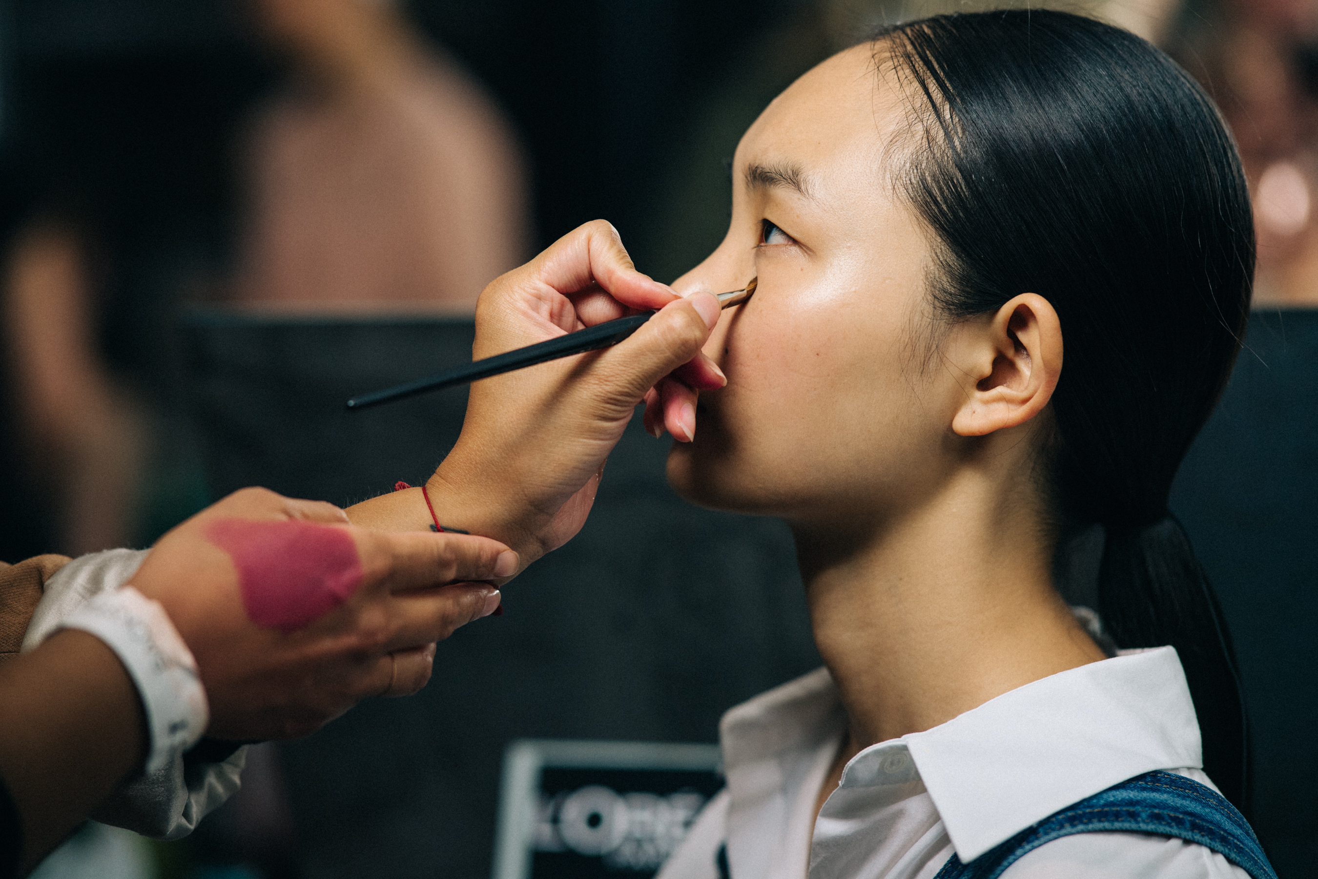 Model getting hair and make up done