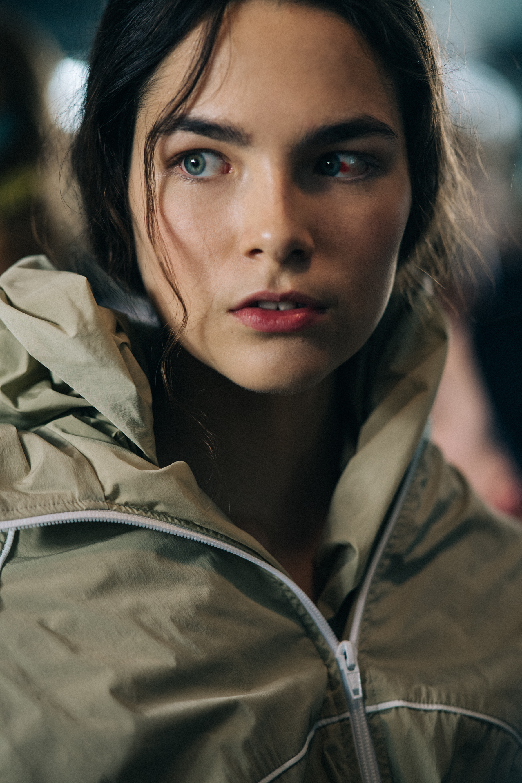 Model with bloodshot eye before a show