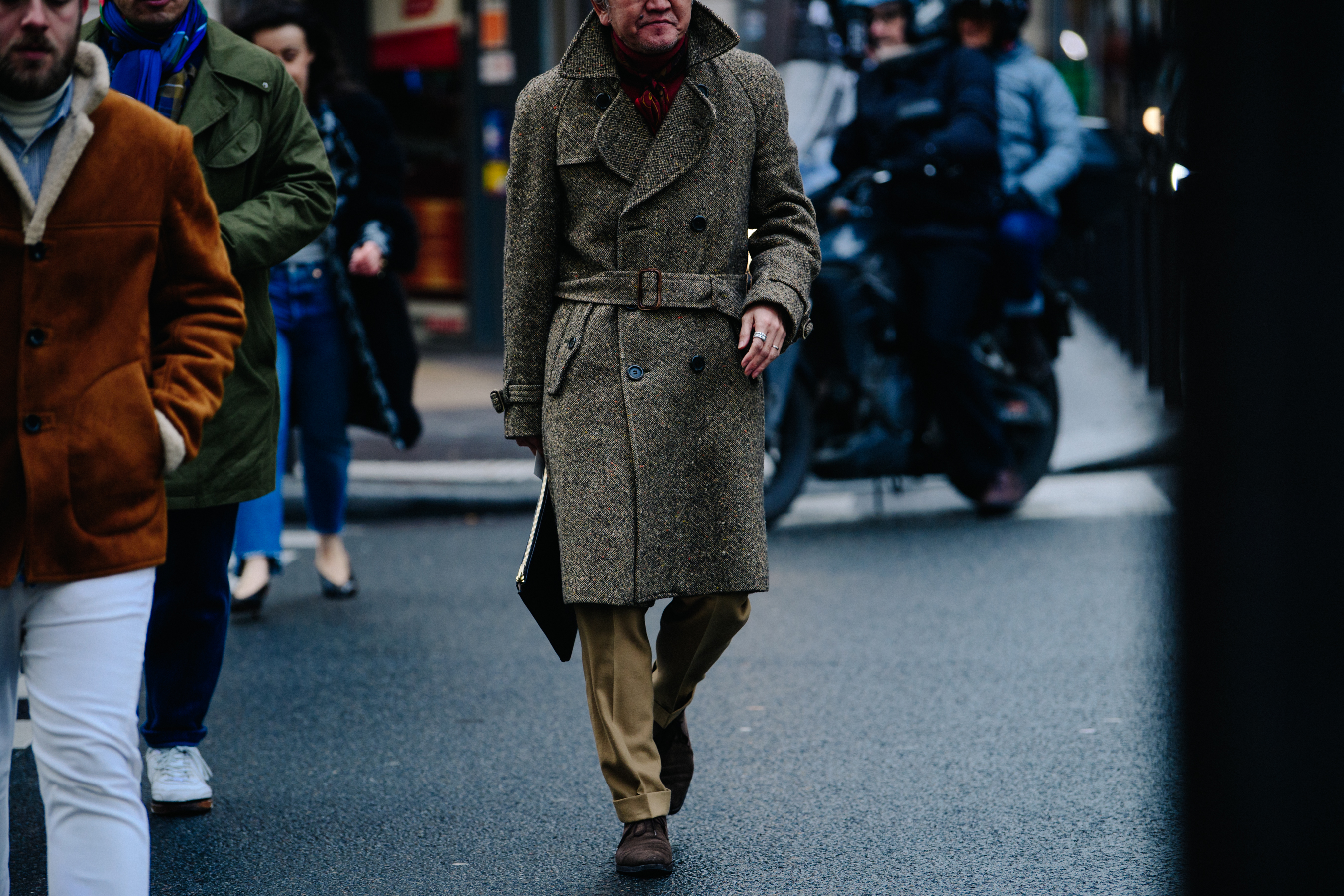 Asian man wearing belted wool coat