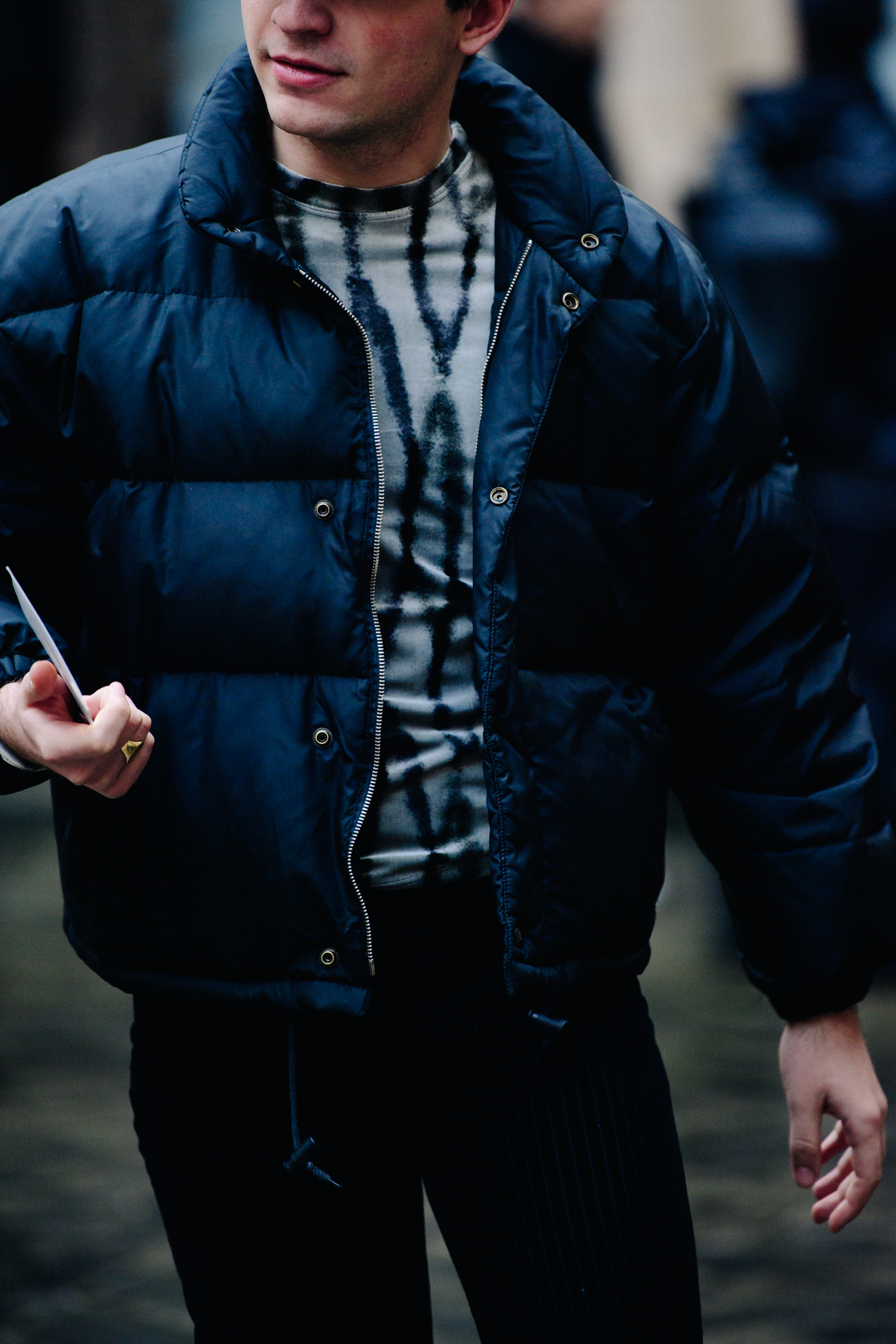 Man wearing dark blue puffer jacket