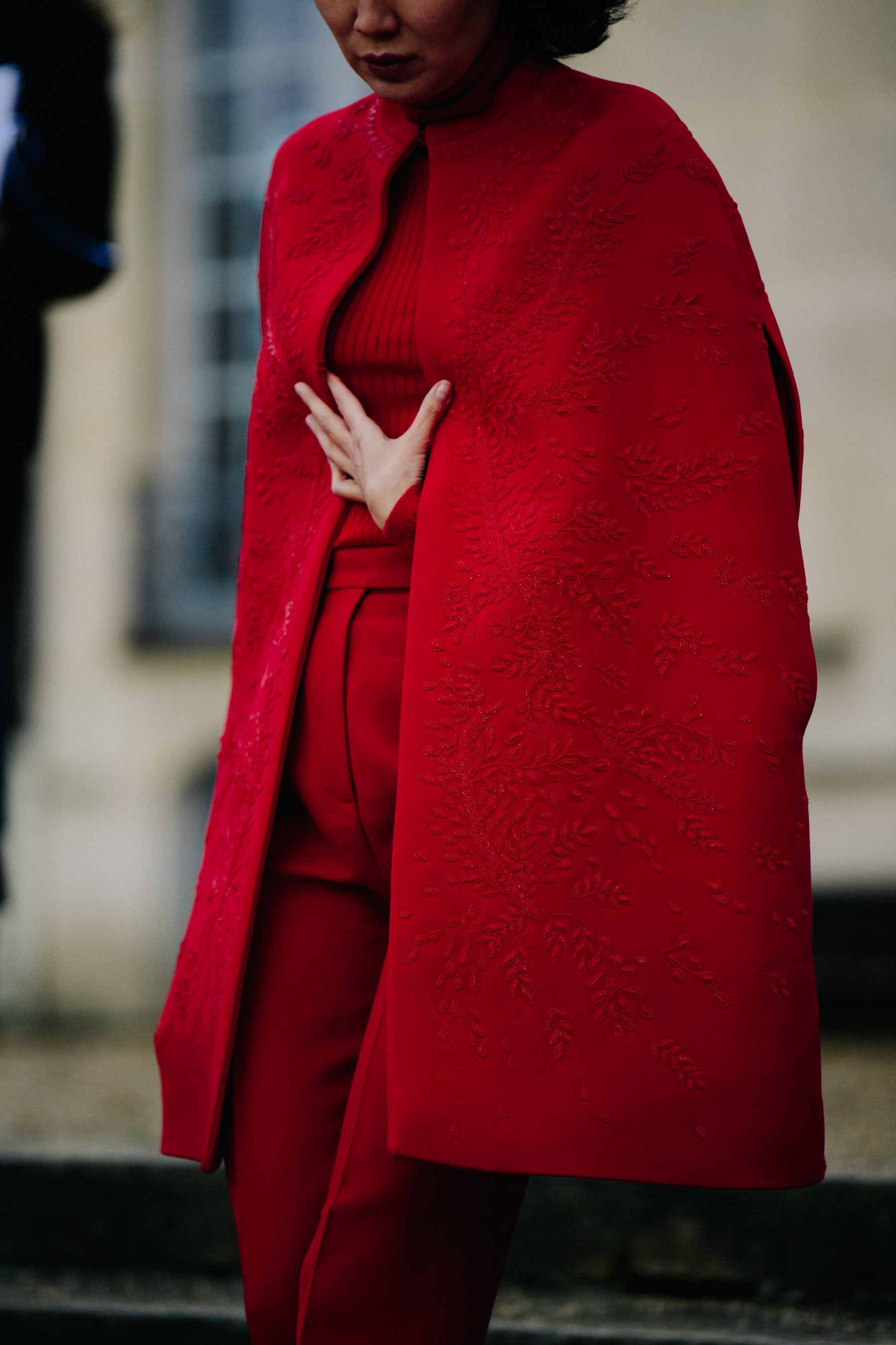 Woman wearing red cape