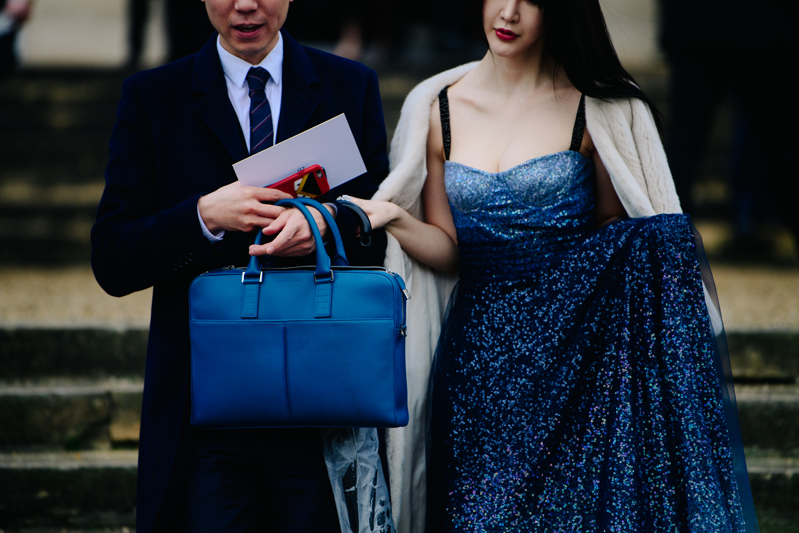 Asian couple wearing Dior outfits