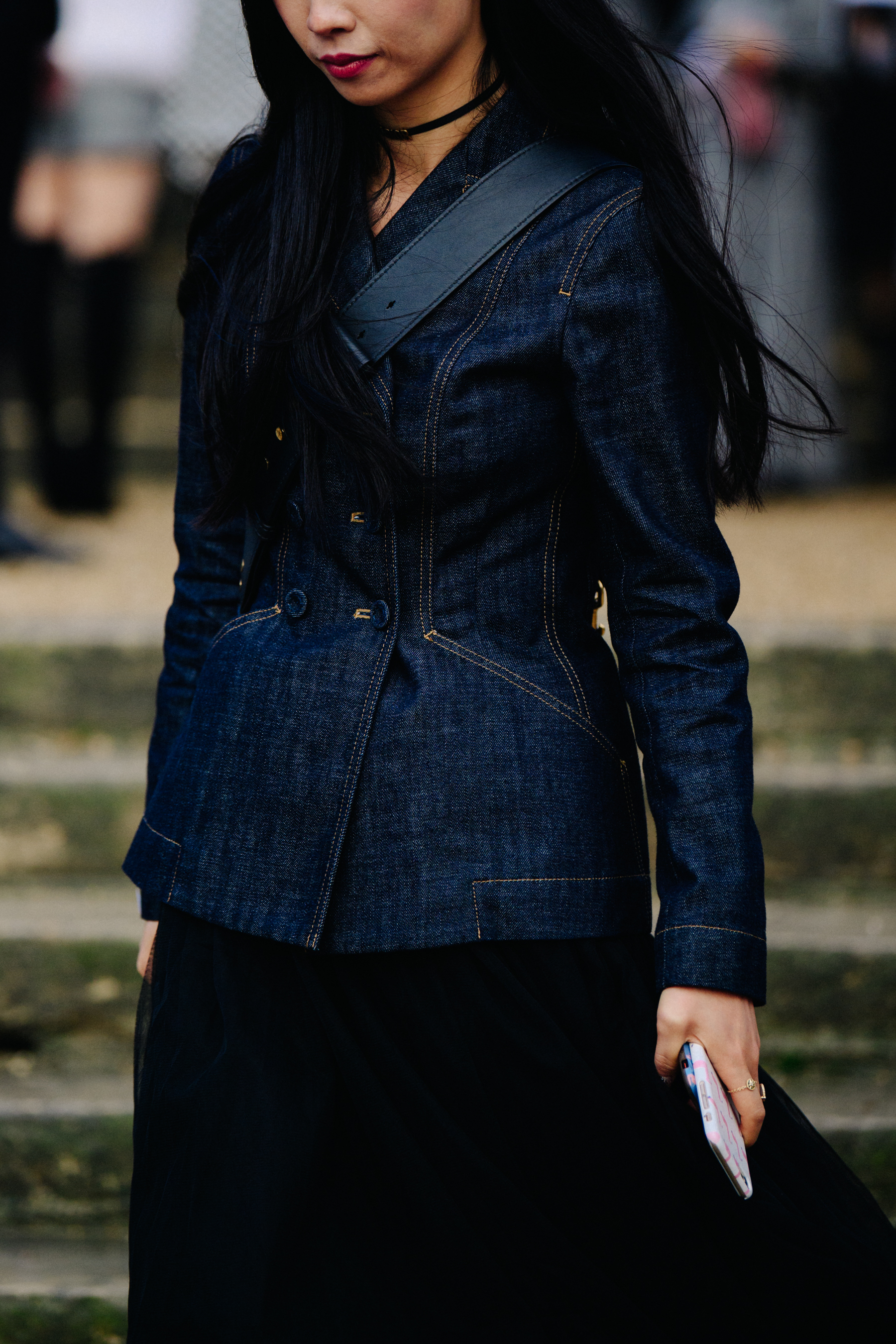 Asian woman wearing denim jacket