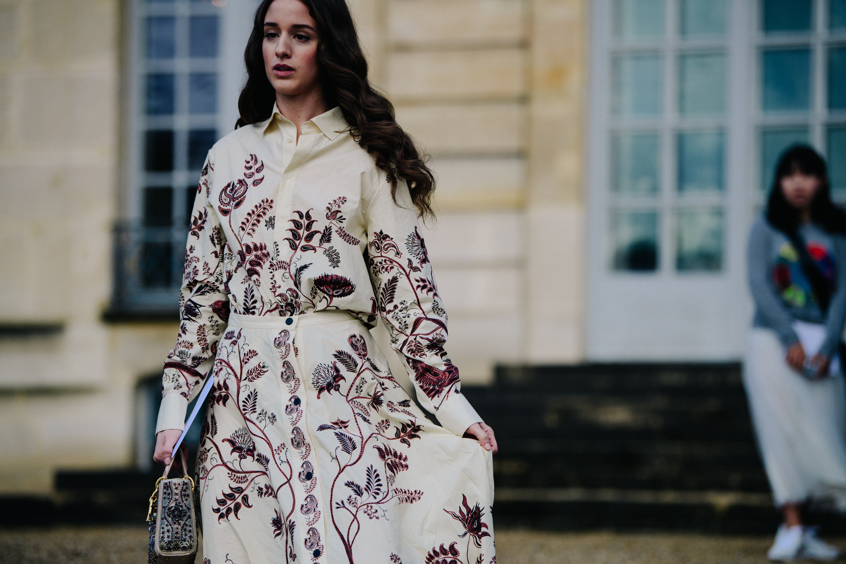 Woman wearing floral white dress