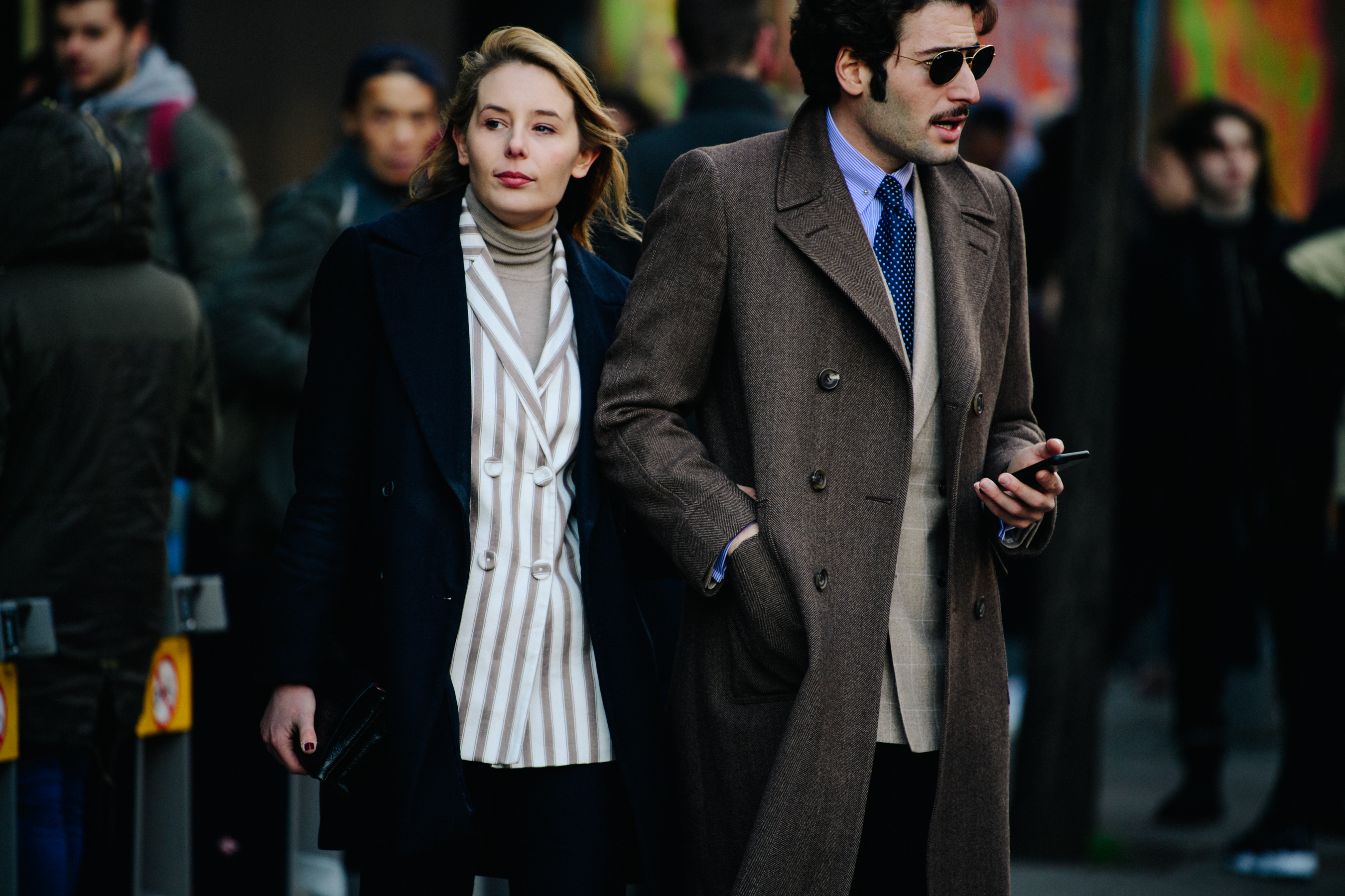 Couple wearing double breasted coats