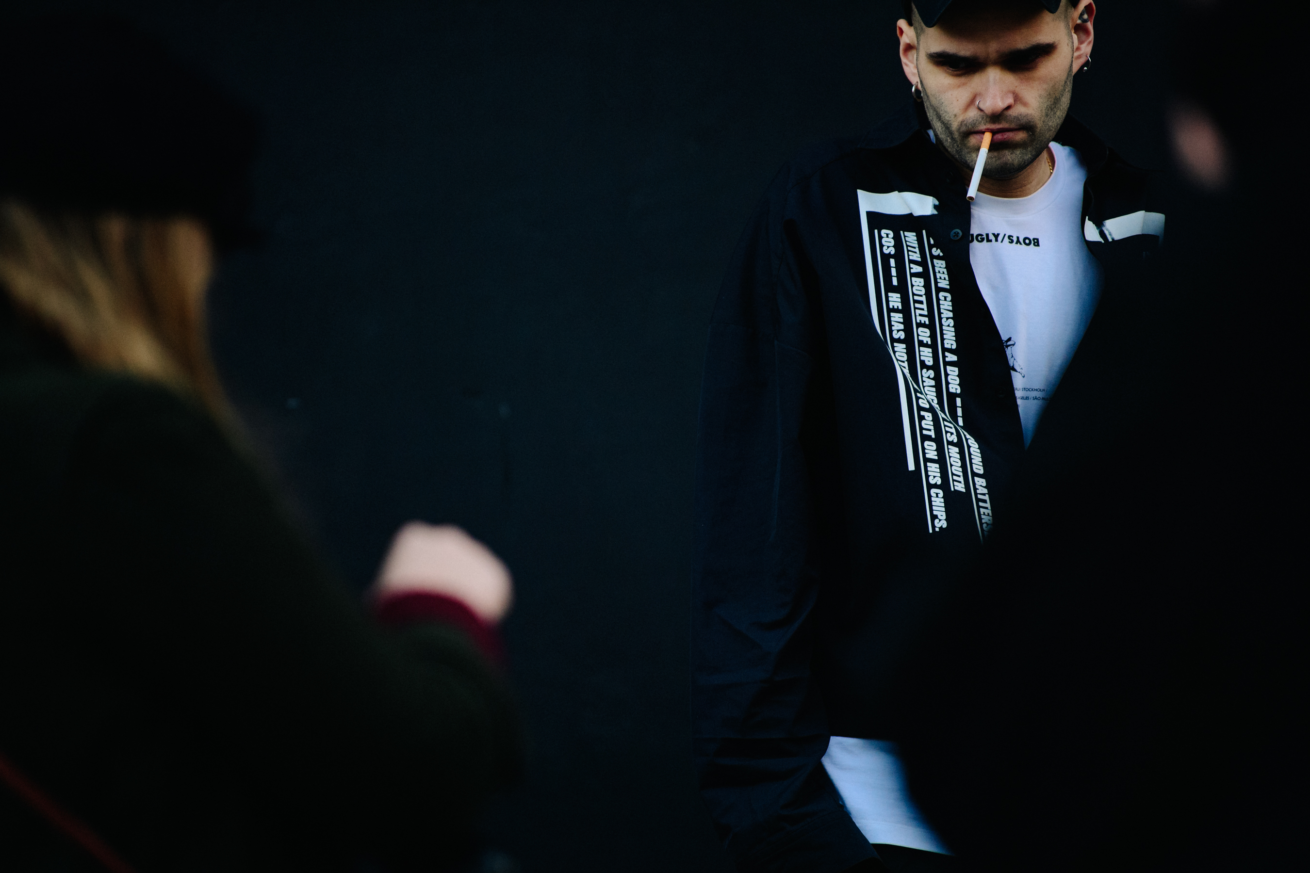 Man wearing black graphic print shirt