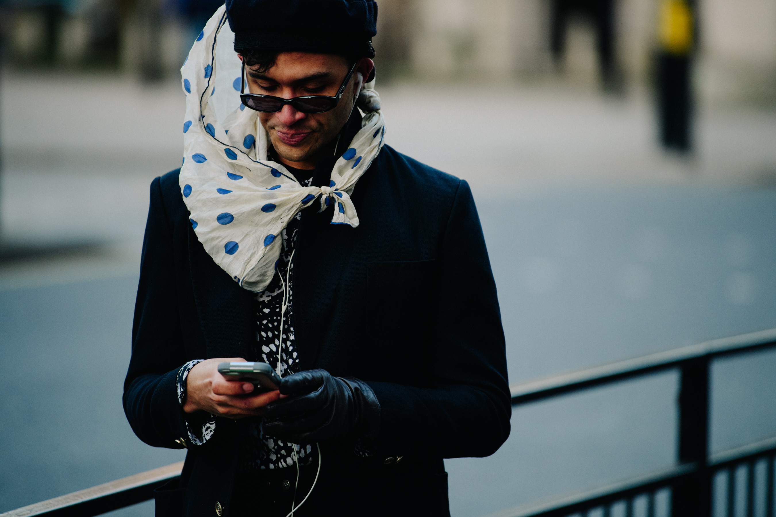 Man wearing polka dot scarf