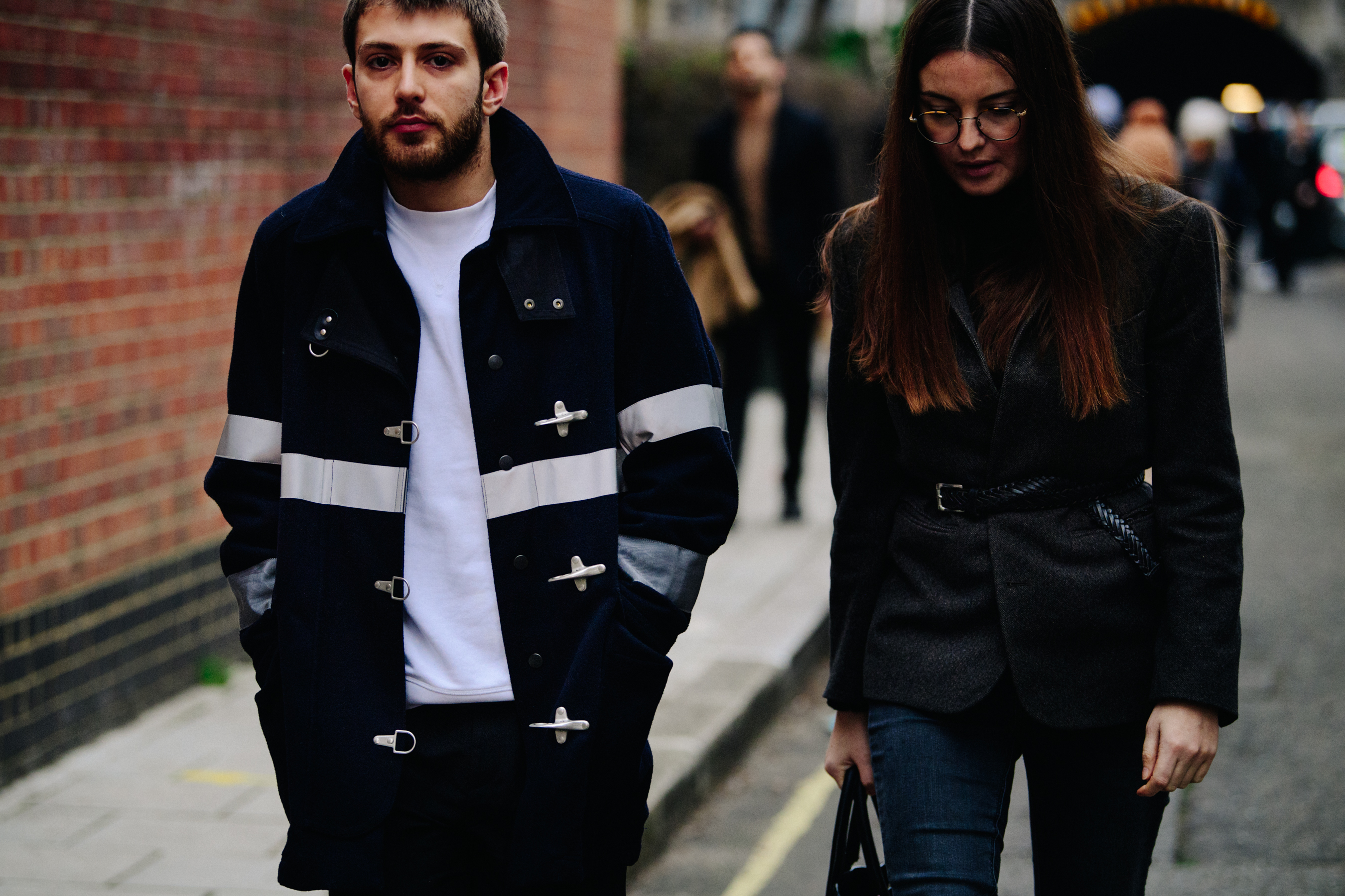 Couple wearing dark outfits