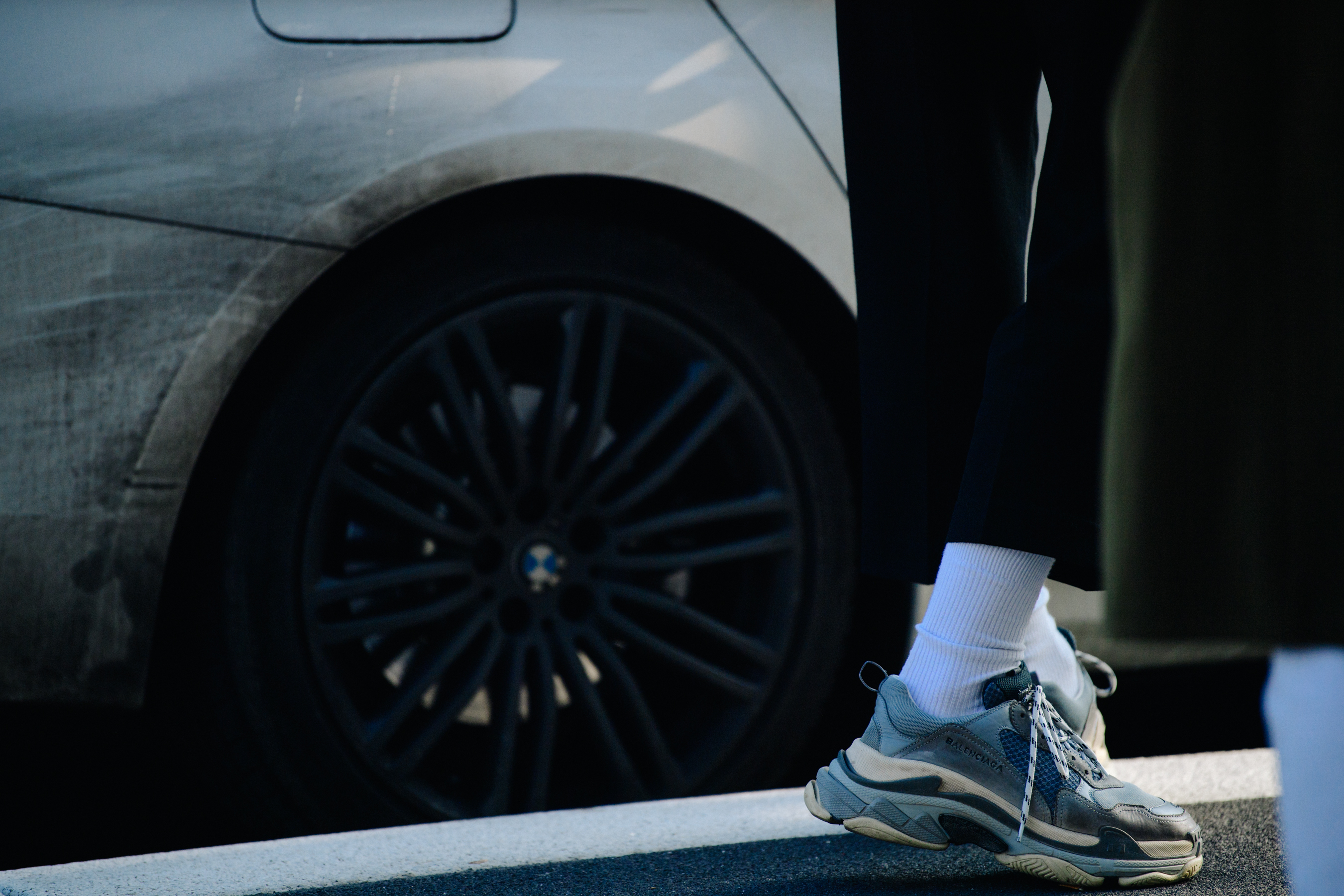 Man wearing grey Balenciaga sneakers