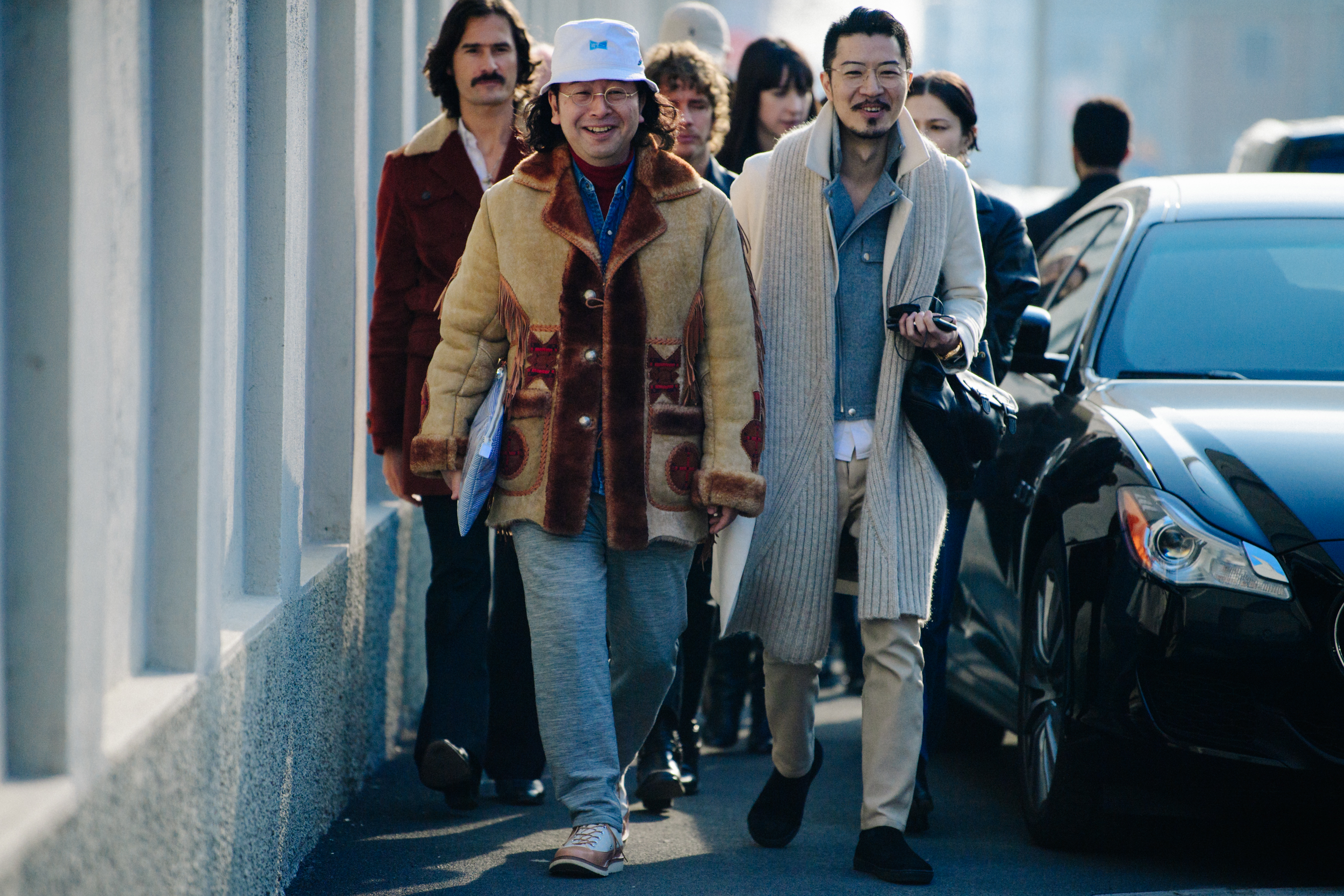 Two Asian men wearing thick wool coats