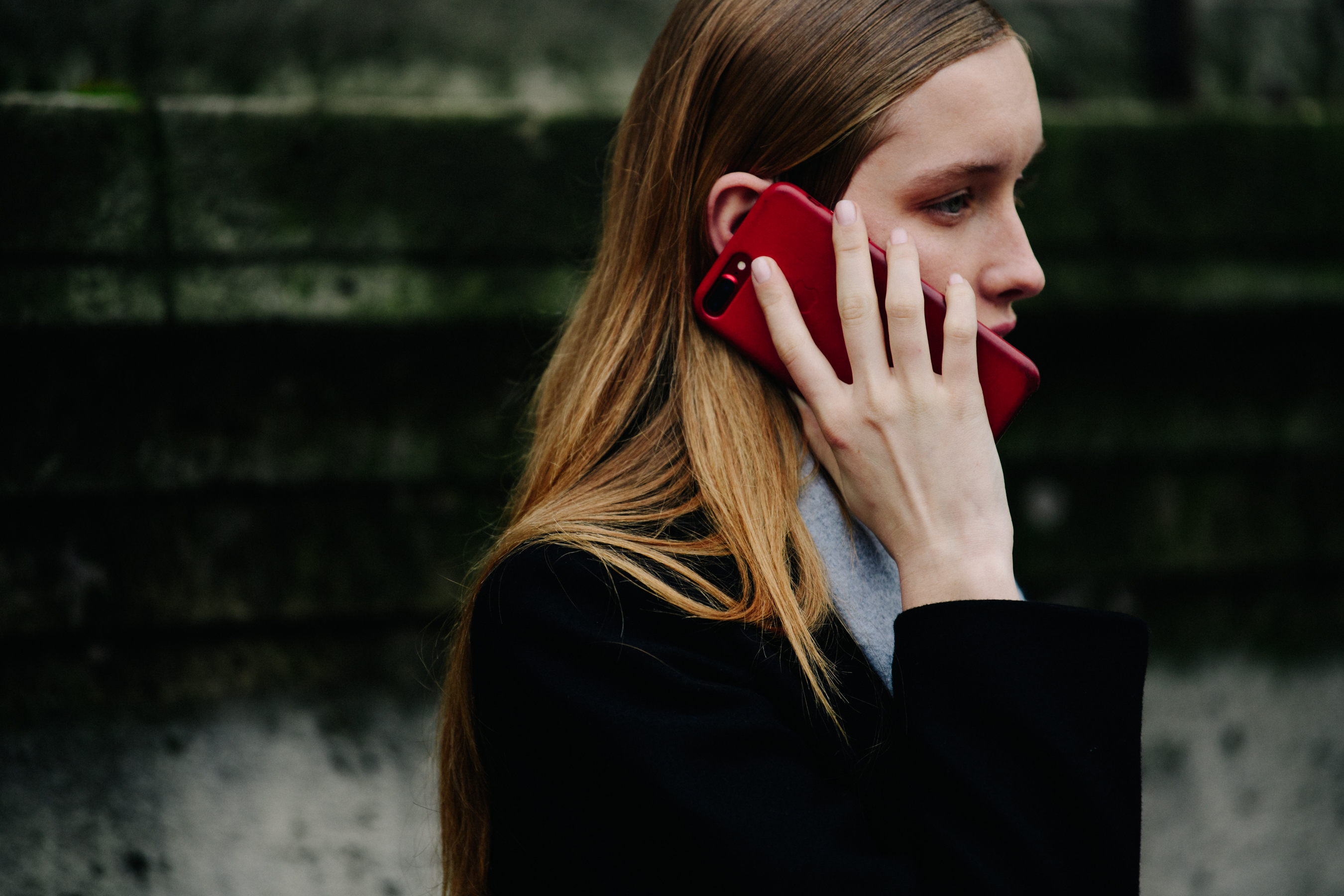 Blonde model with red iPhone