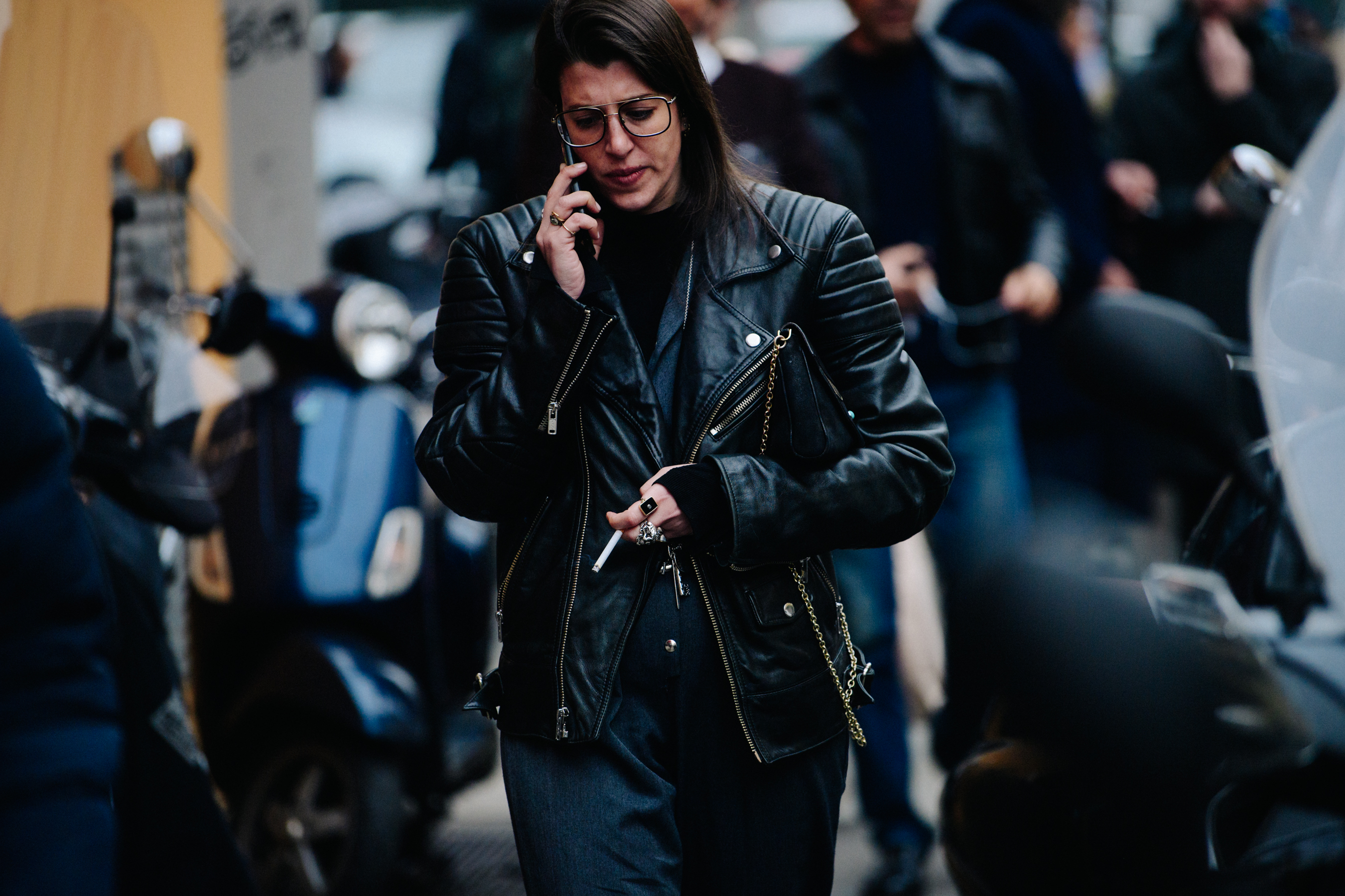 Woman wearing black leather biker jacket