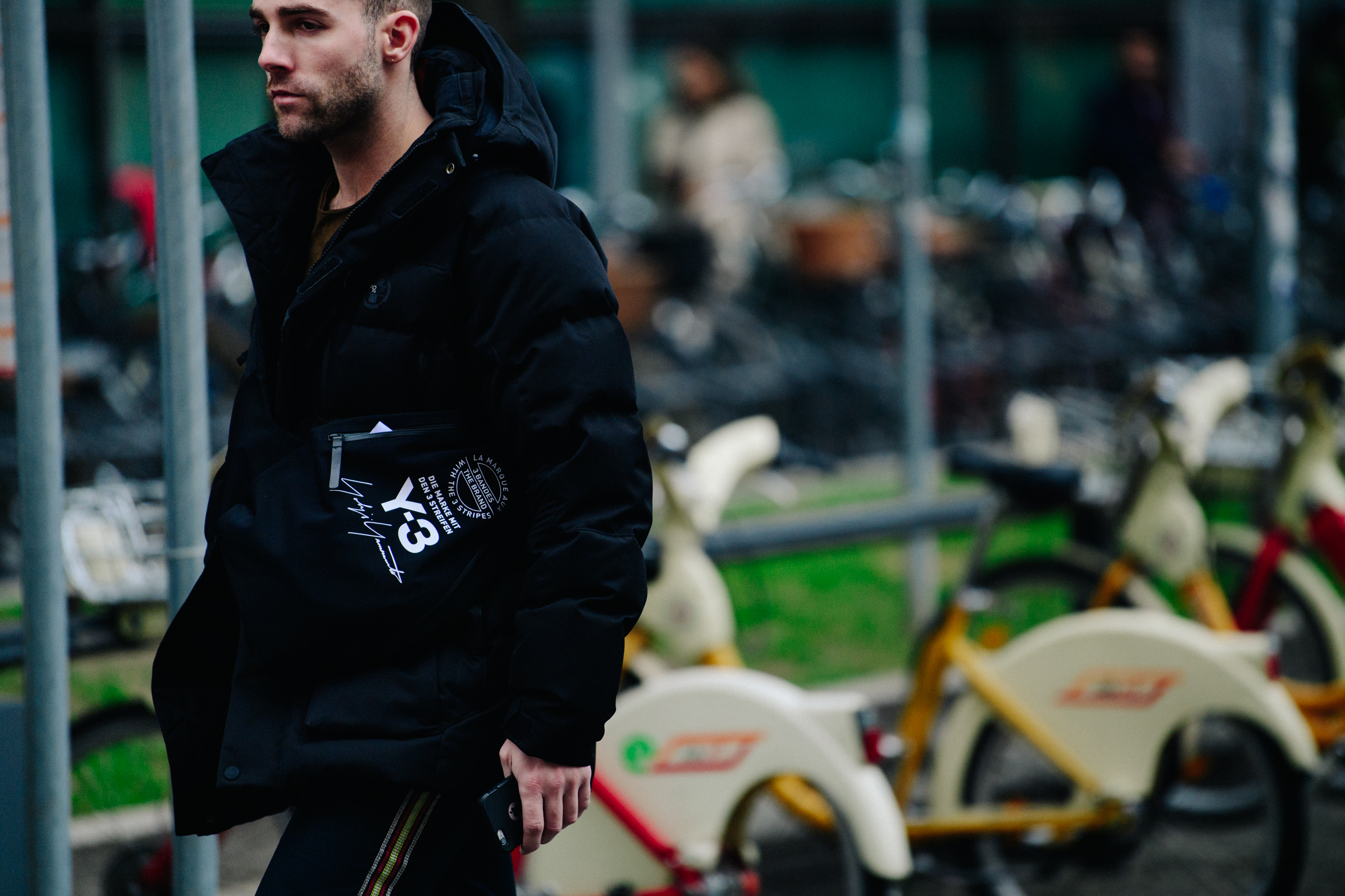 Man wearing black Y-3 bag