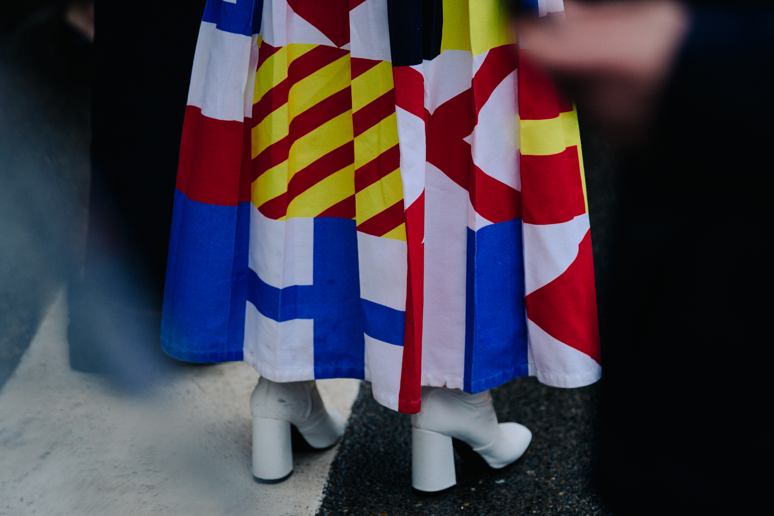 Woman wearing white heeled boots