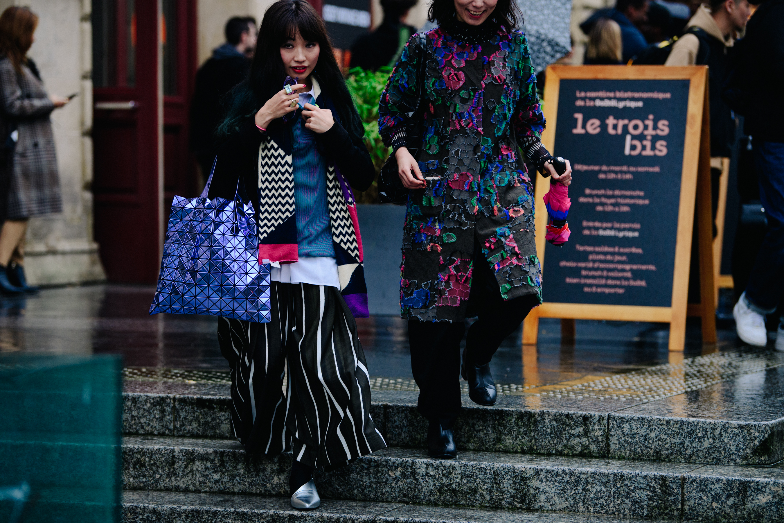 Two Asian women wearing colourful clothing