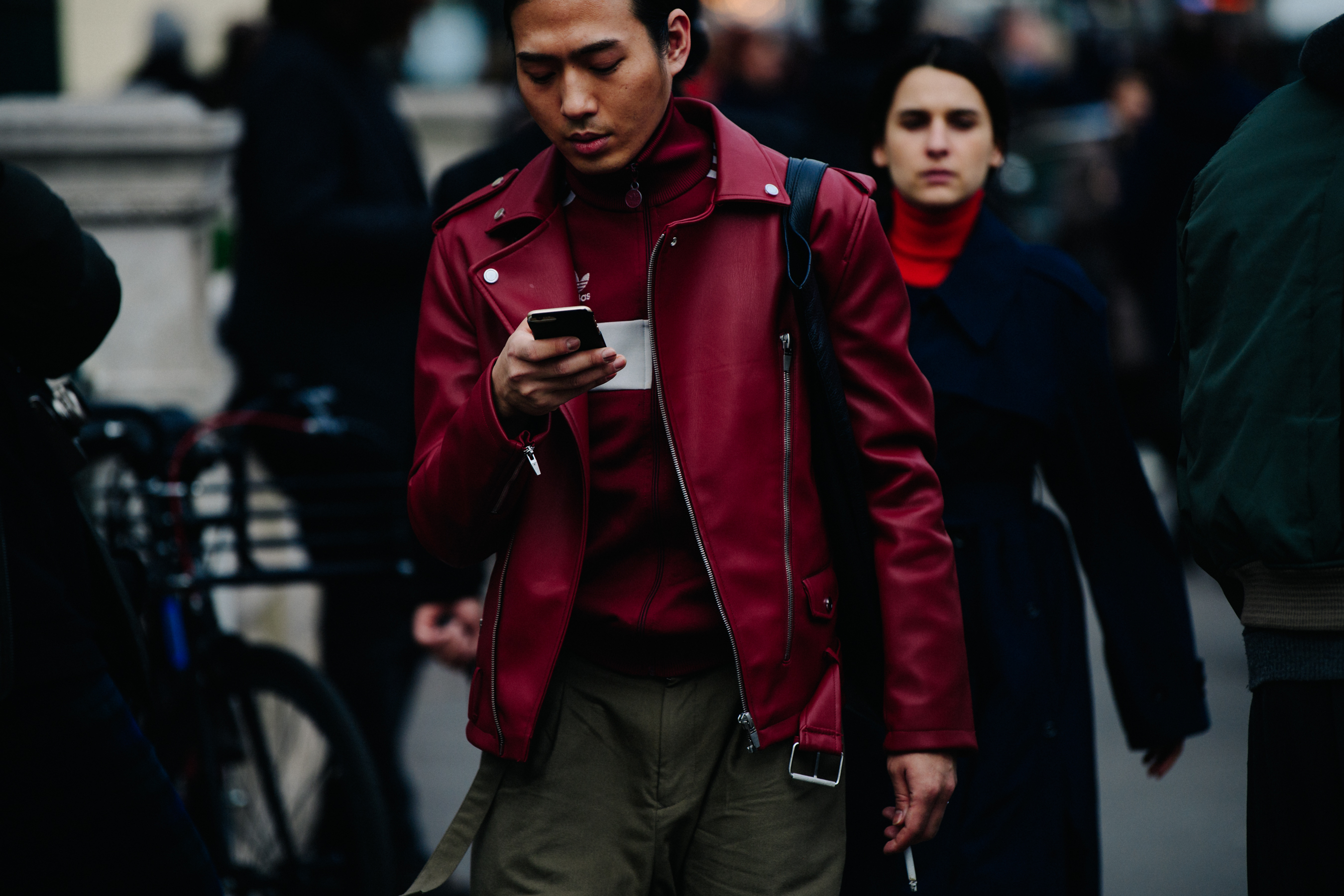 Asian man wearing red leather jacket
