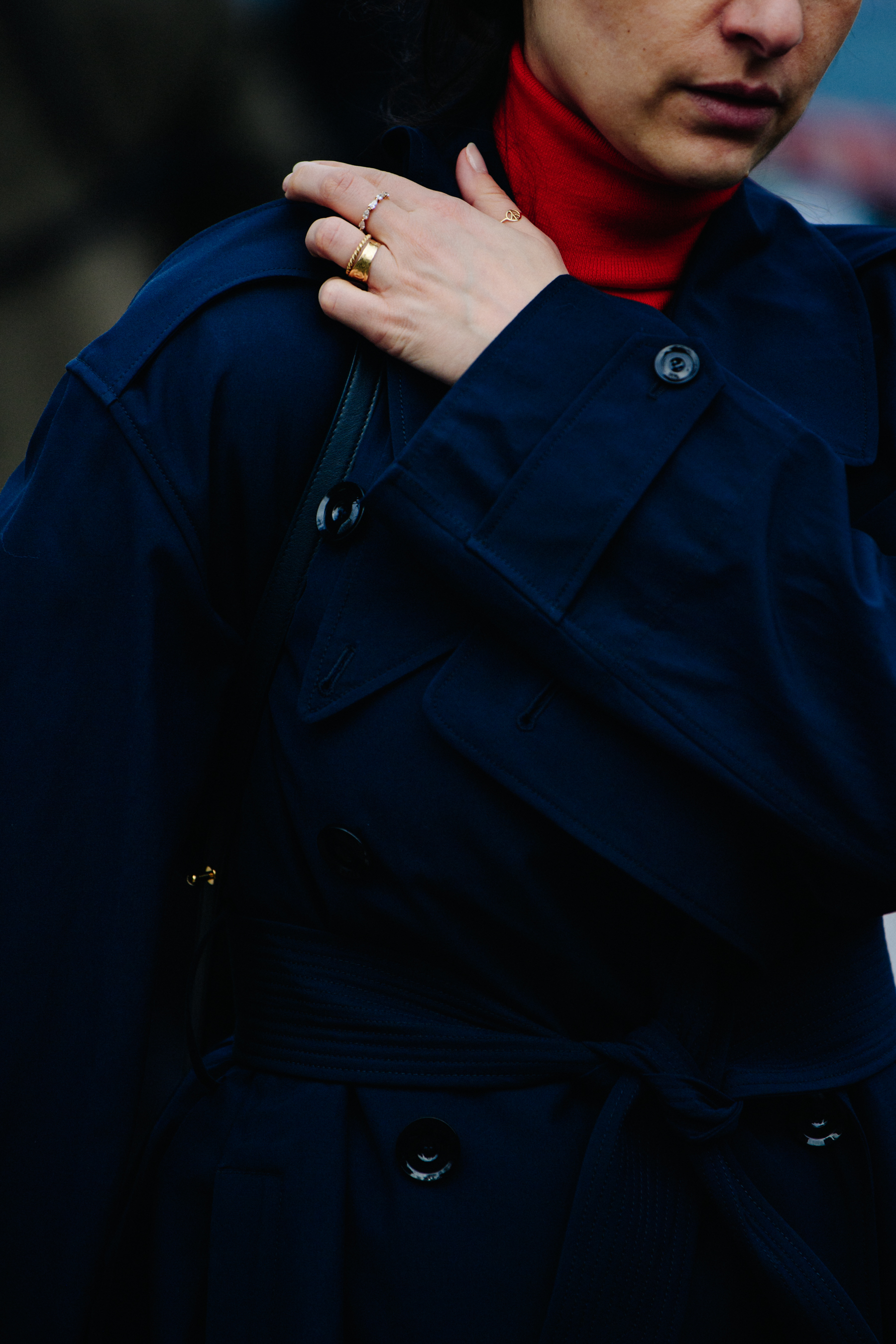 Woman wearing blue trench coat