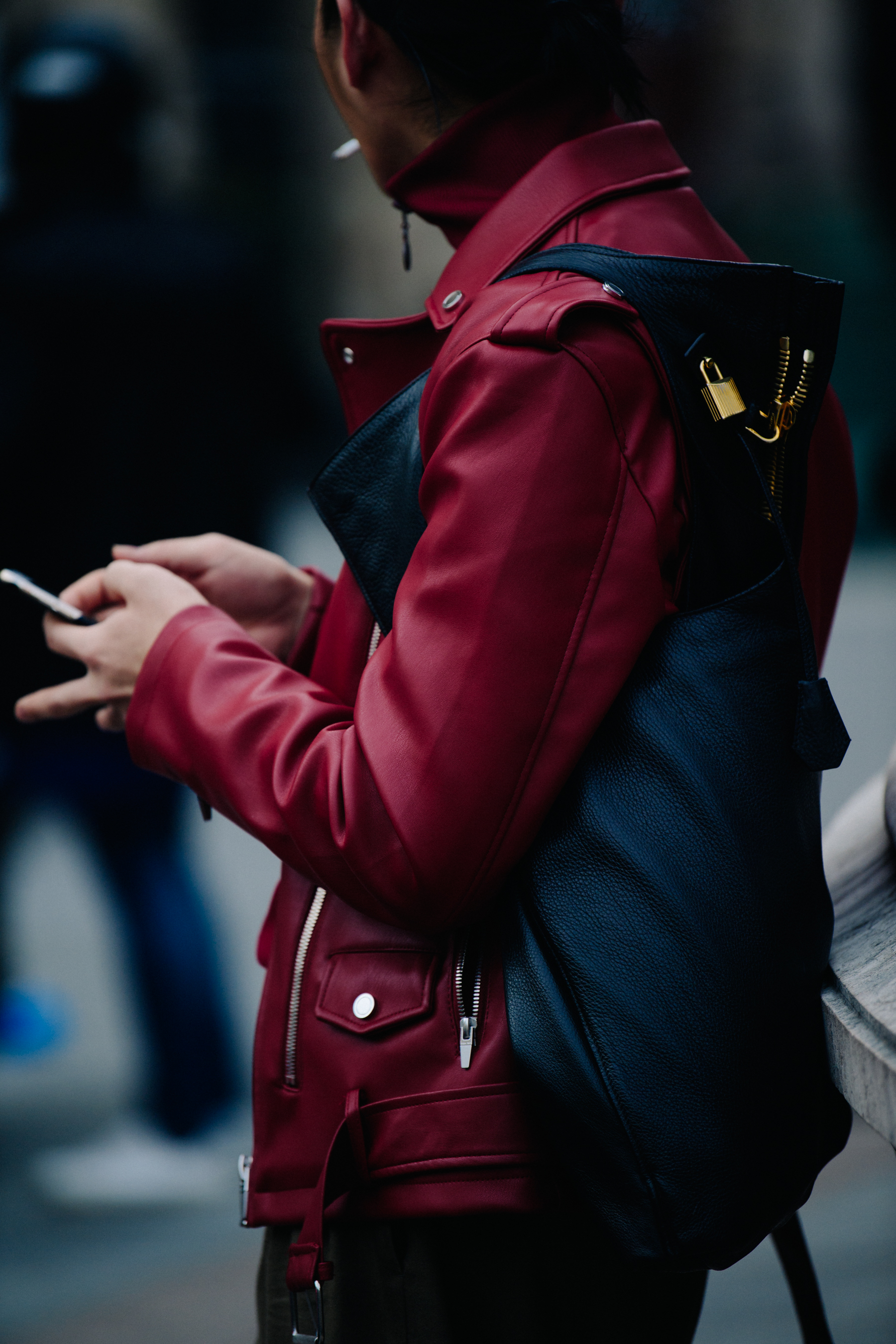 Asian man wearing red leather jacket