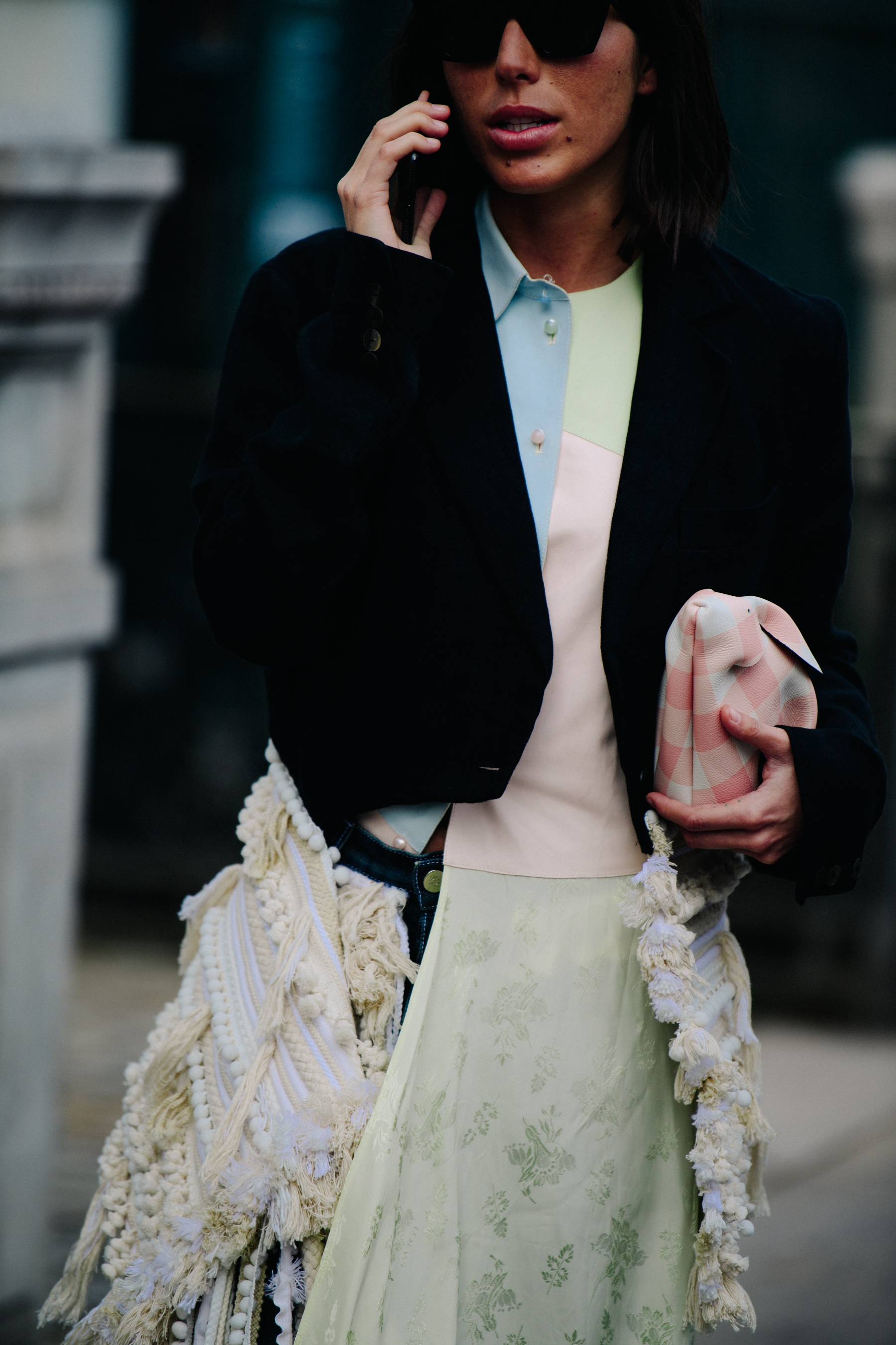 Woman holding pink check bag