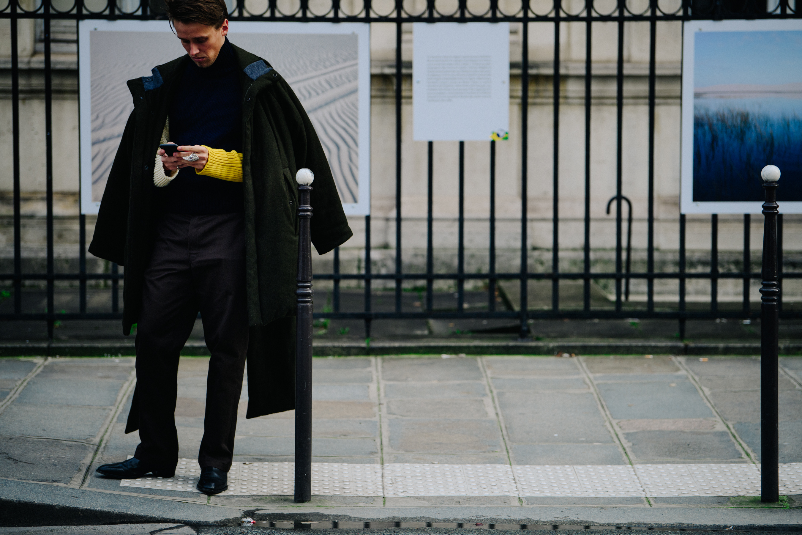 Man wearing thick green coat