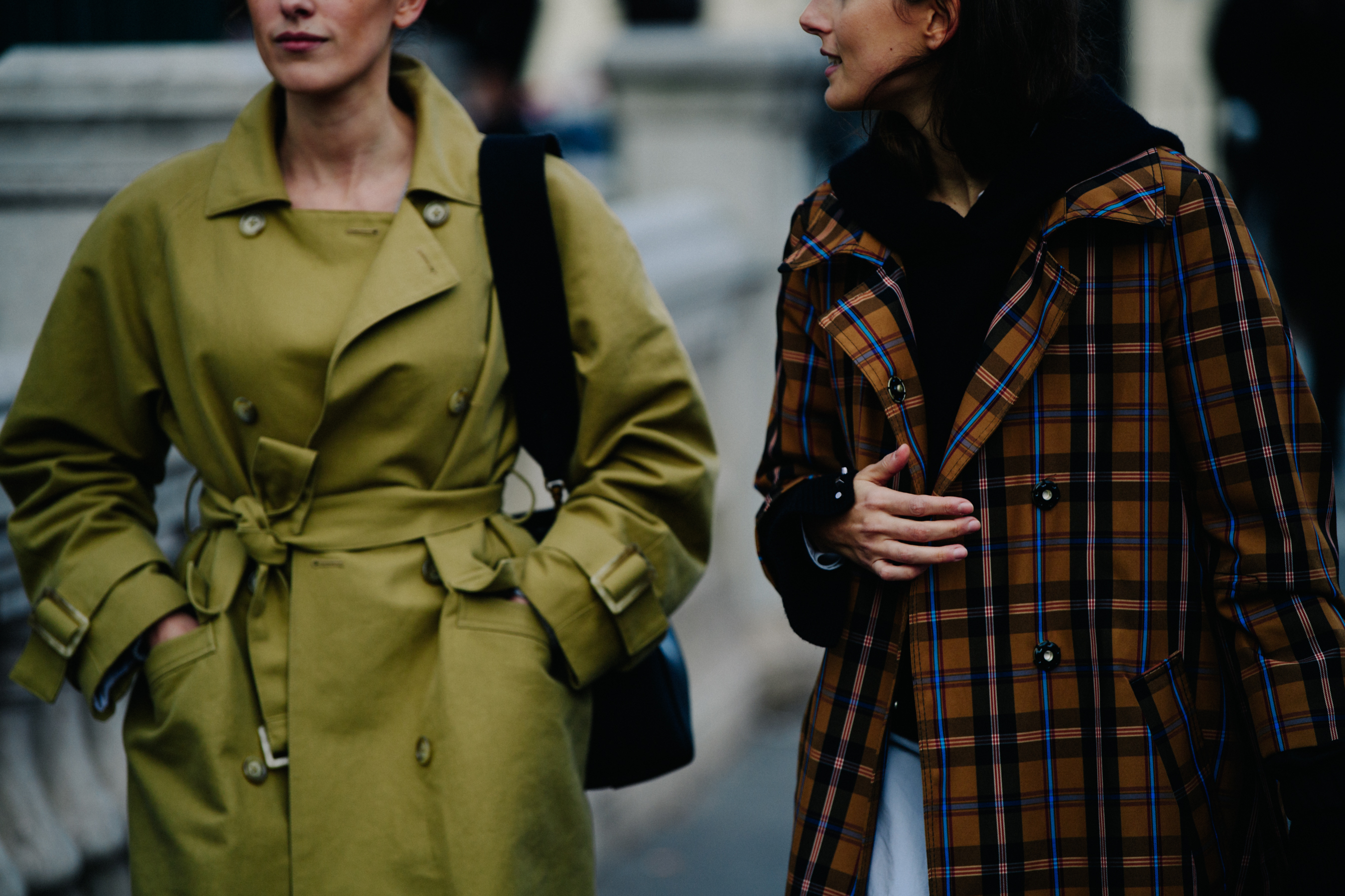 Two women wearing smart winter coats