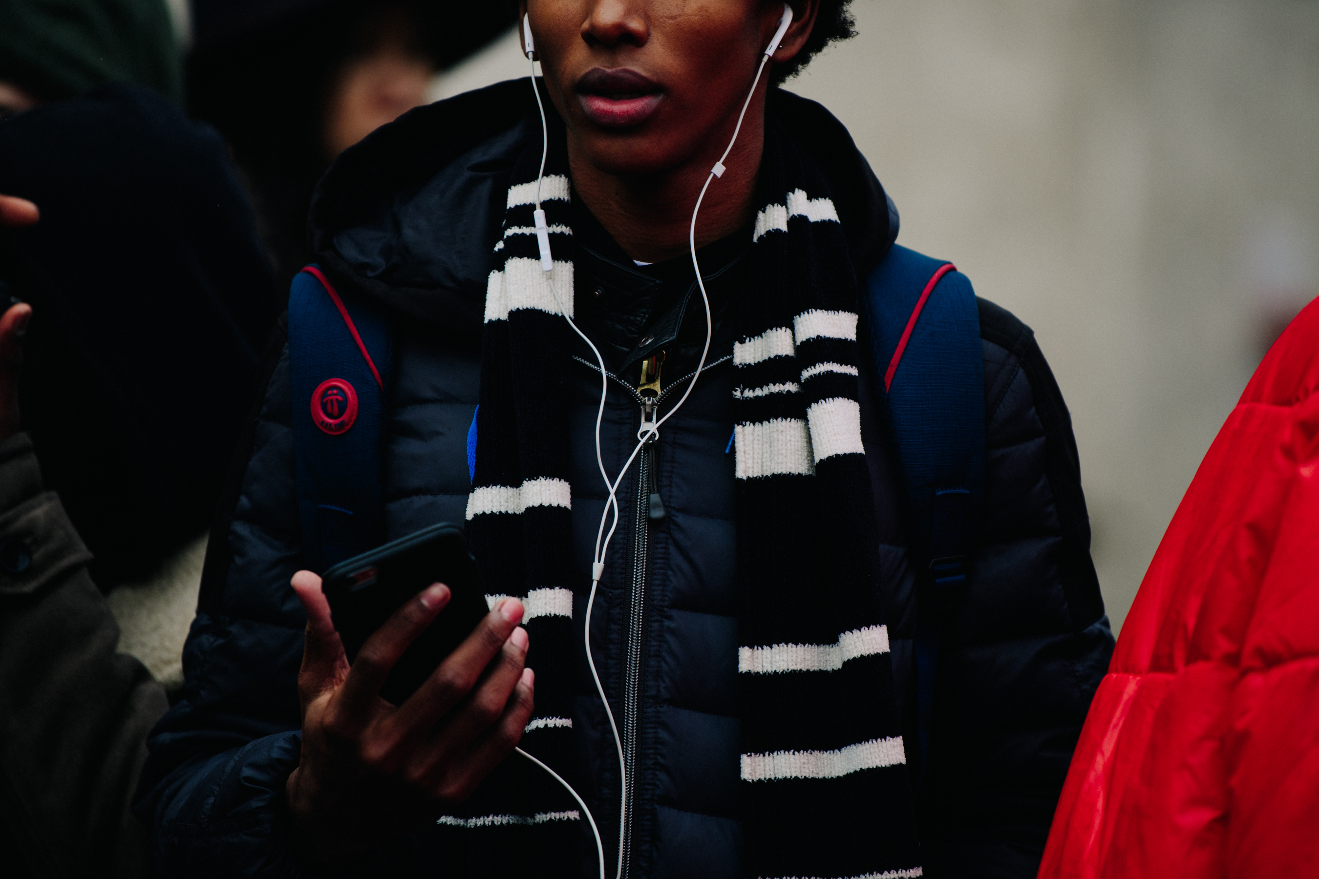 Model wearing black and white scarf
