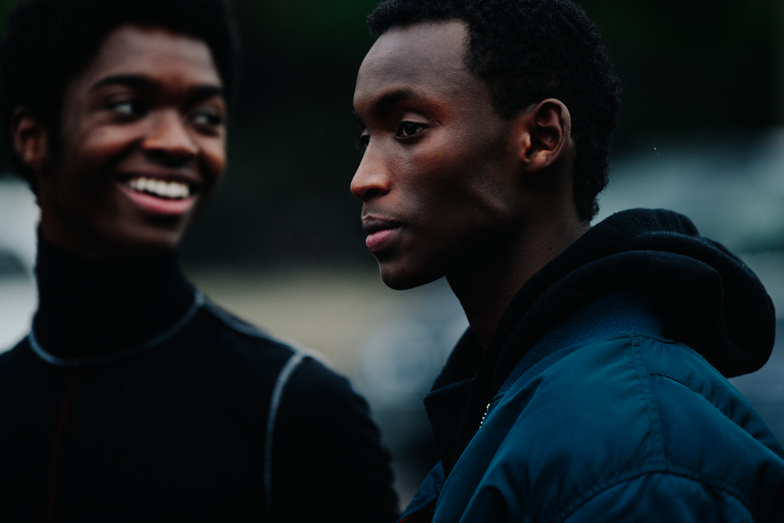 Alton Mason and friend wearing dark coats