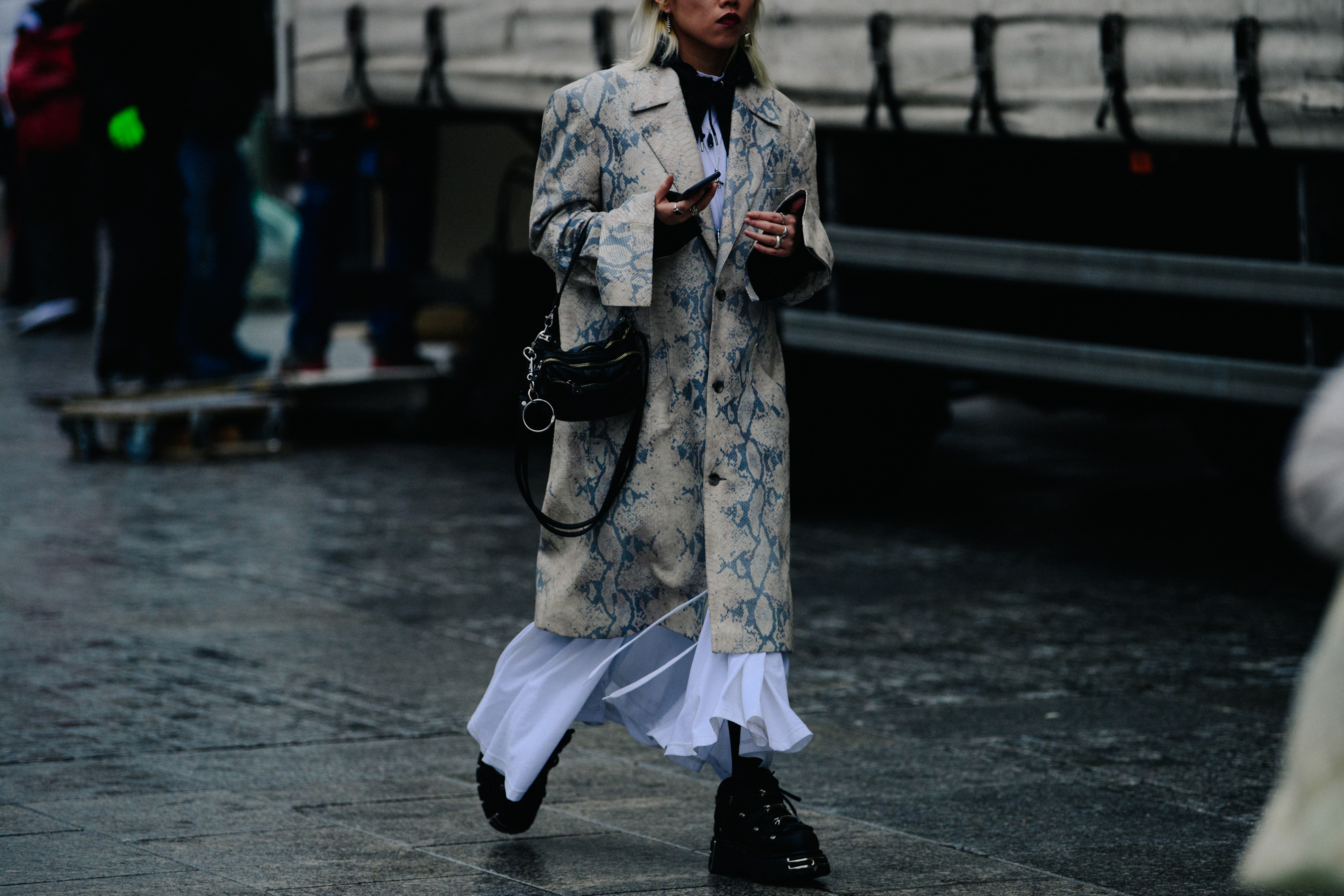 Woman wearing snakeskin coat