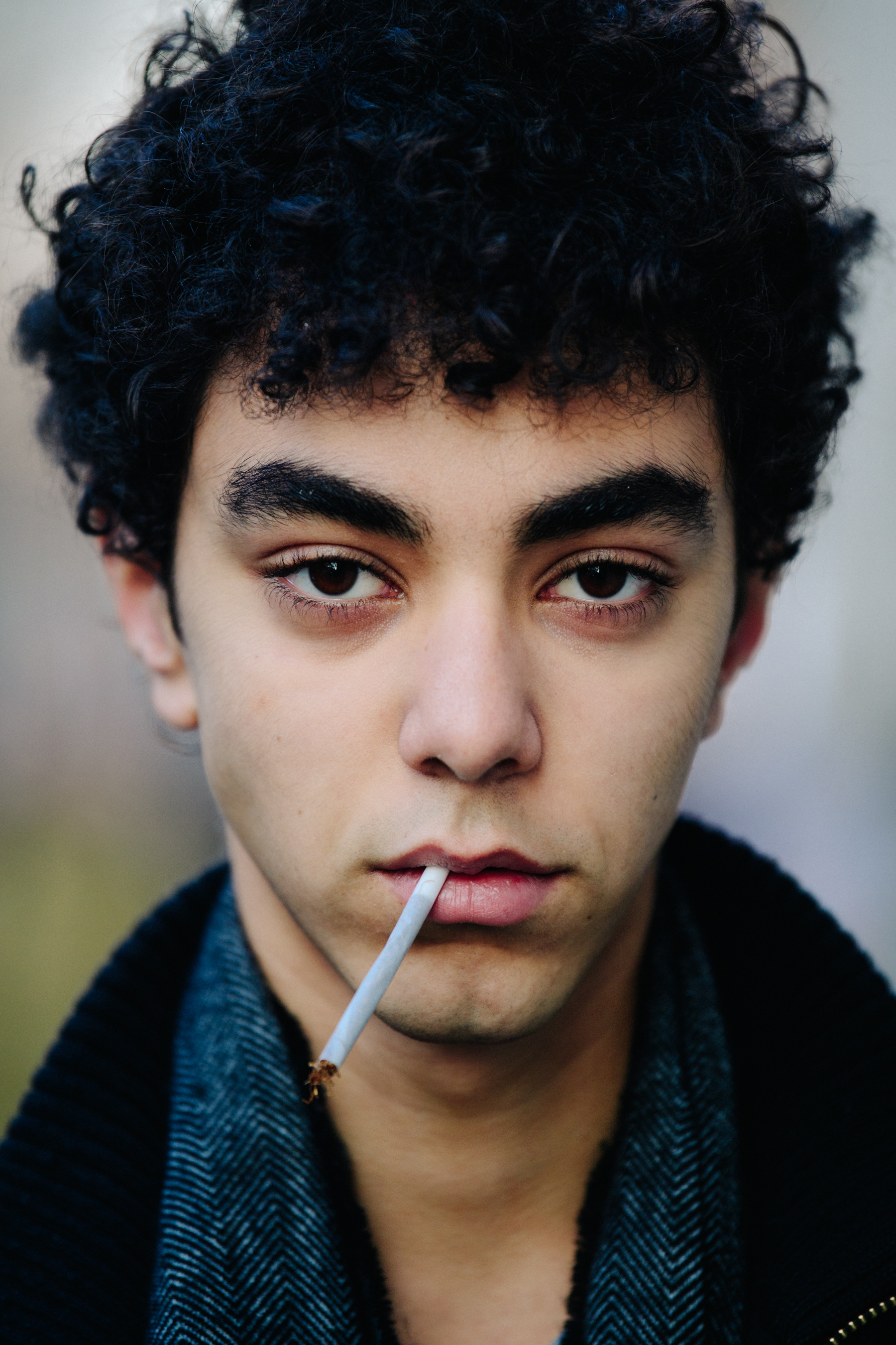 Portrait of model with cigarette in mouth