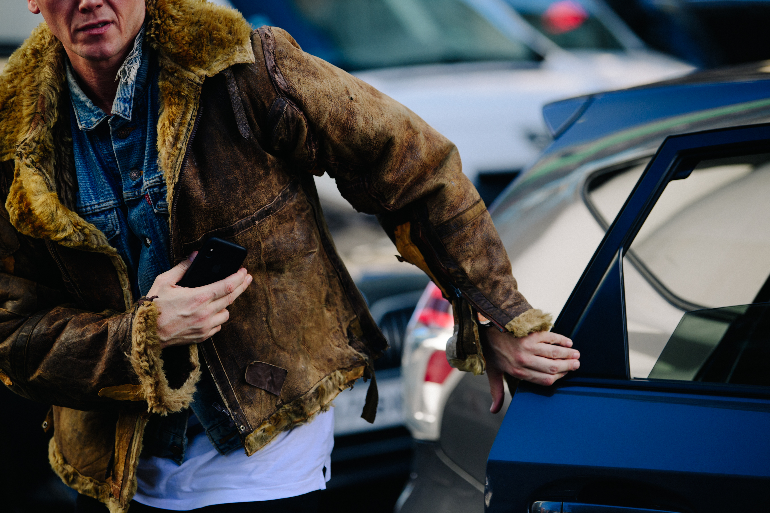 Man wearing fur lined jacket