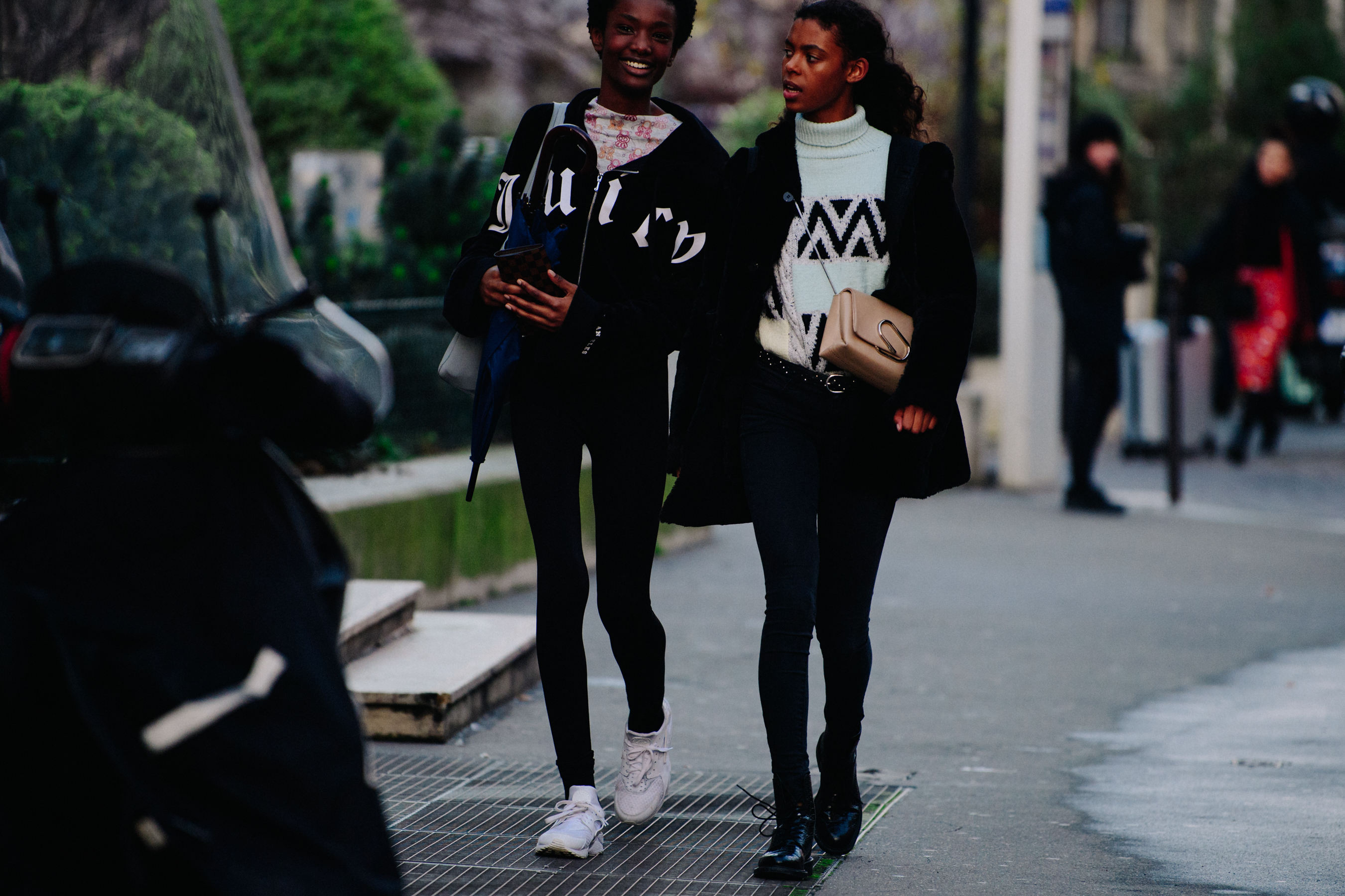 Two models wearing black skinny jeans