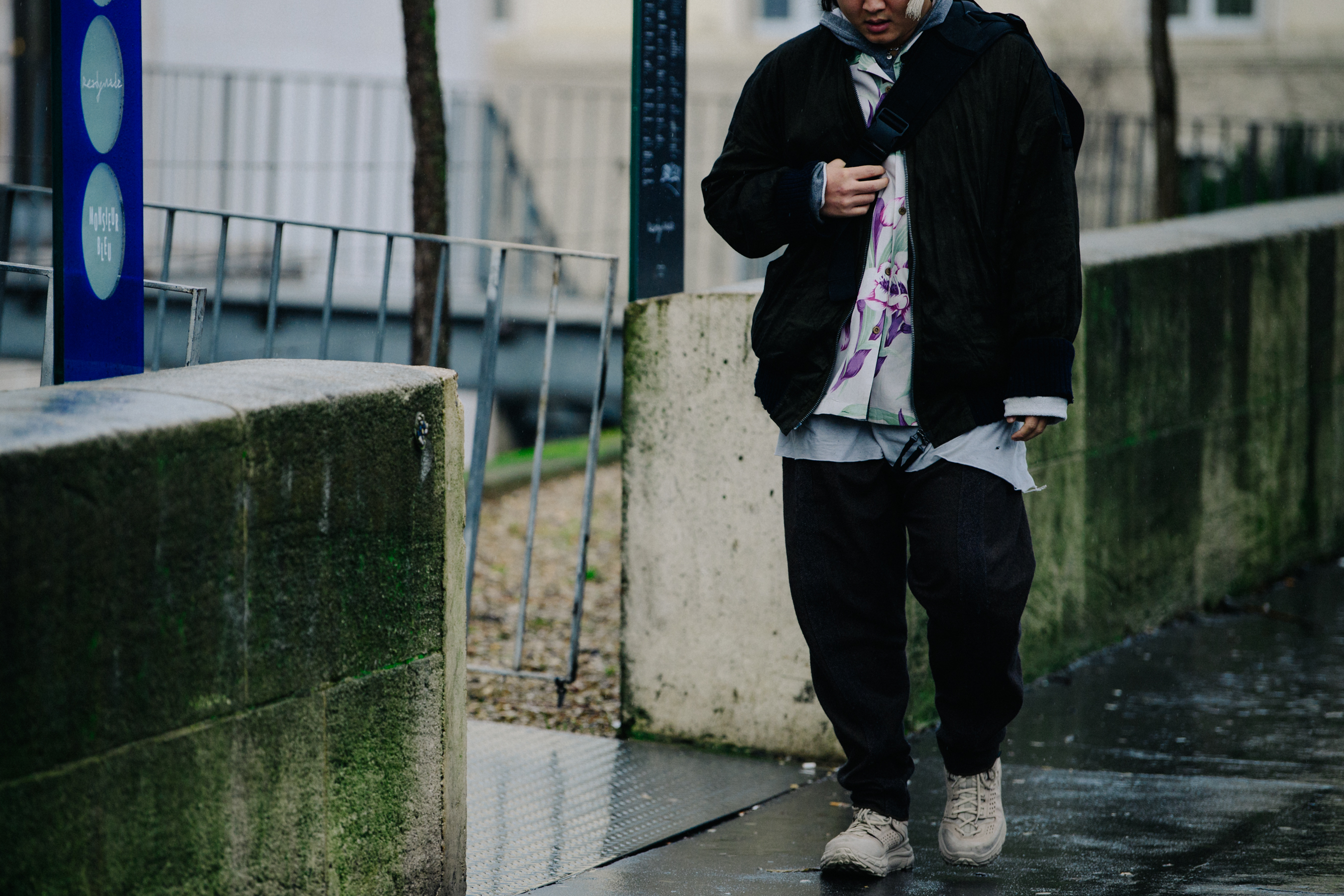 Asian man wearing Hoka boots