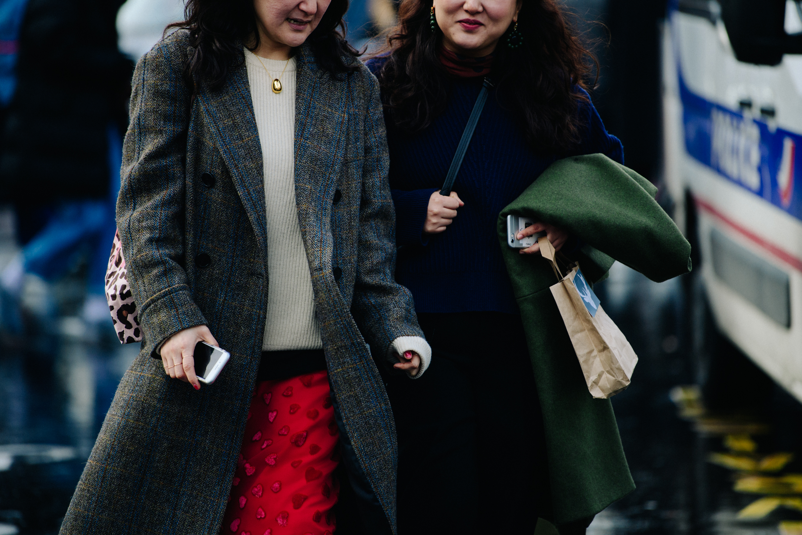 Two women wearing wool coats