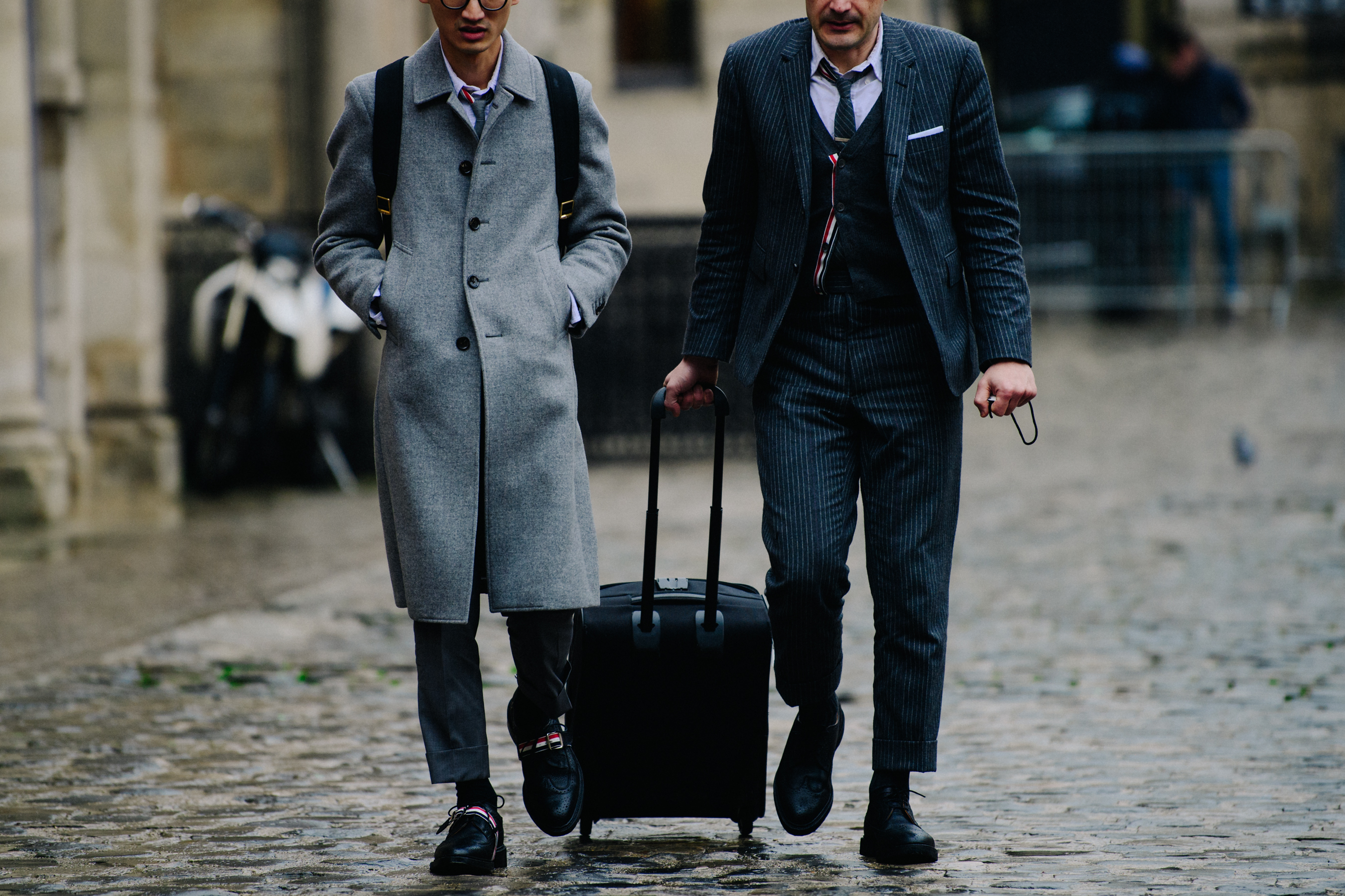 Two men wearing Thom Browne suits