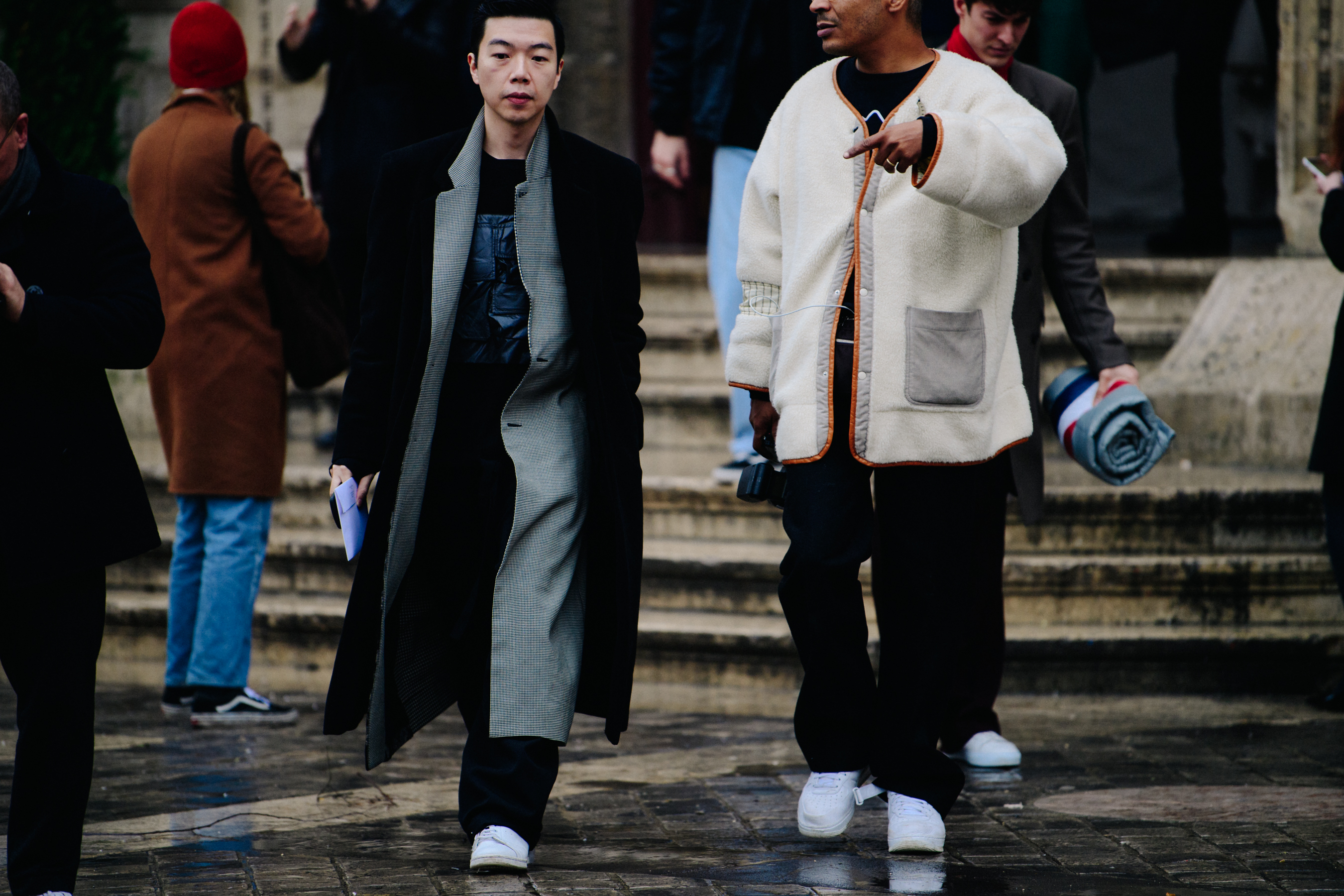Two men wearing white sneakers