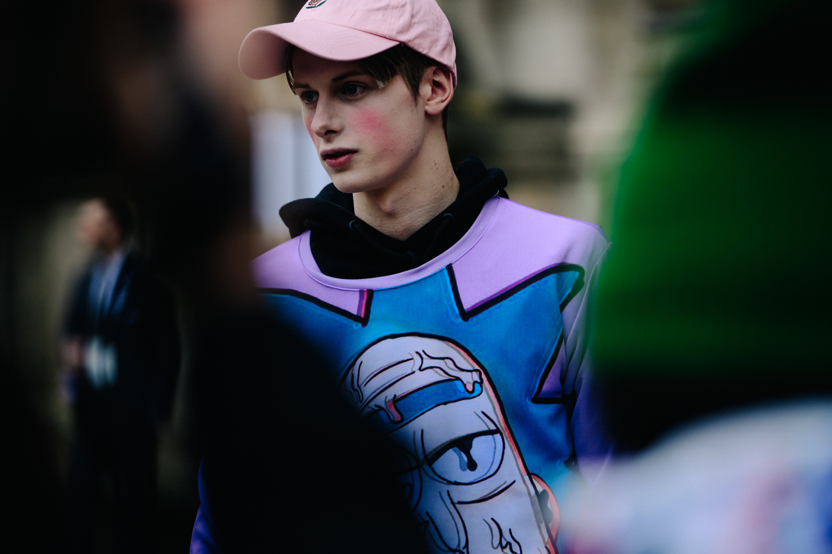 Model wearing pink cap