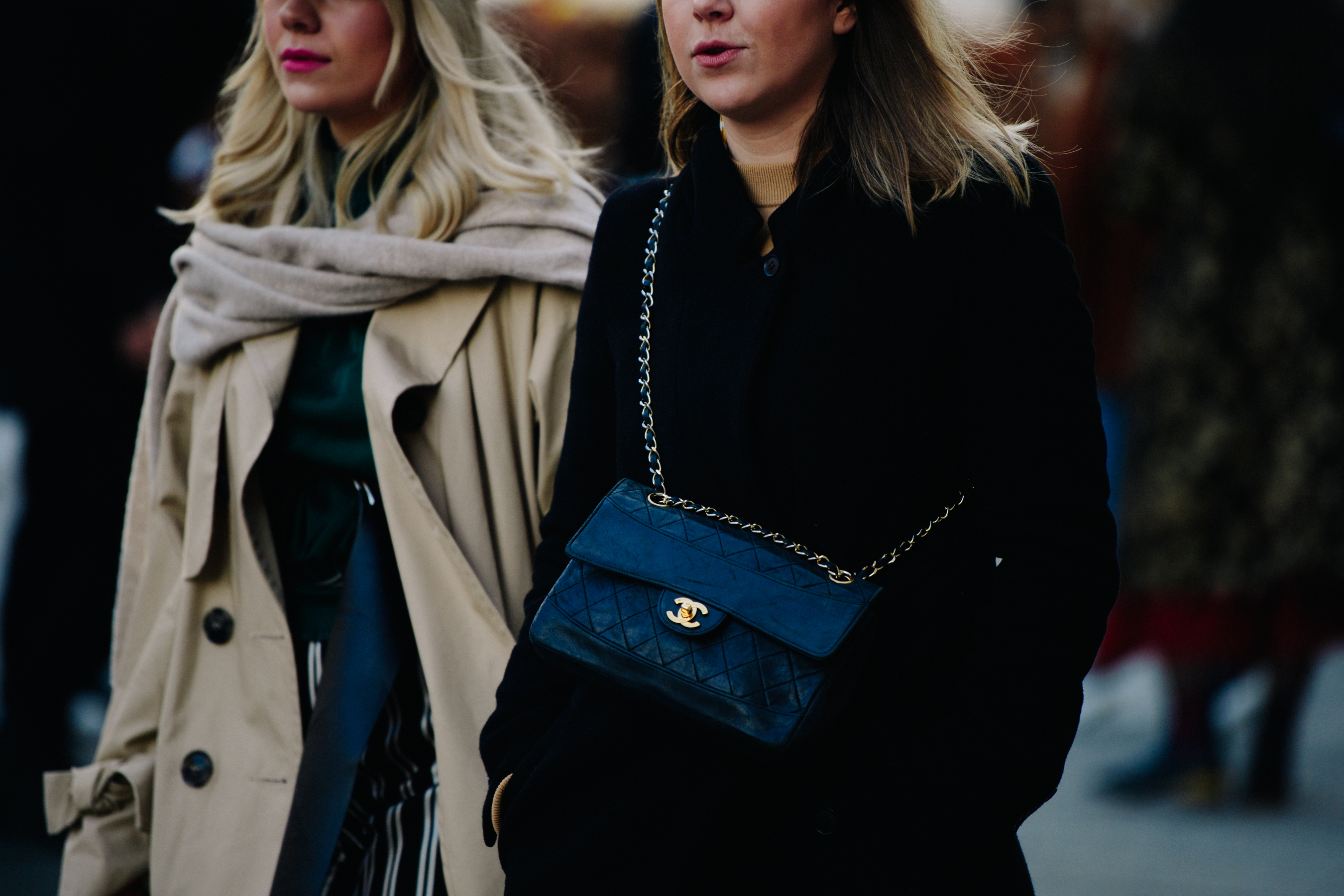 Two women wearing winter coats