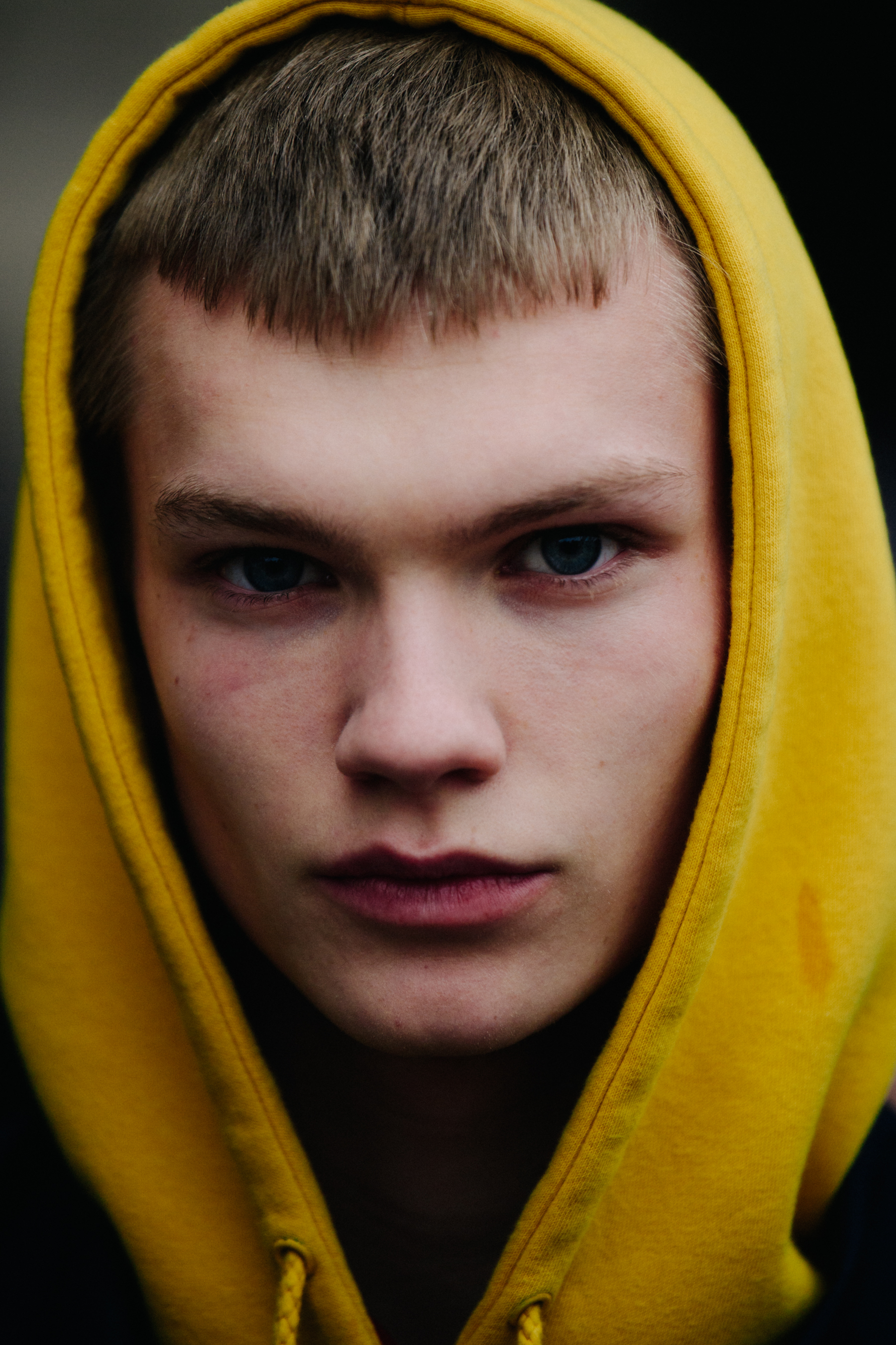 Portrait of model wearing yellow hoodie