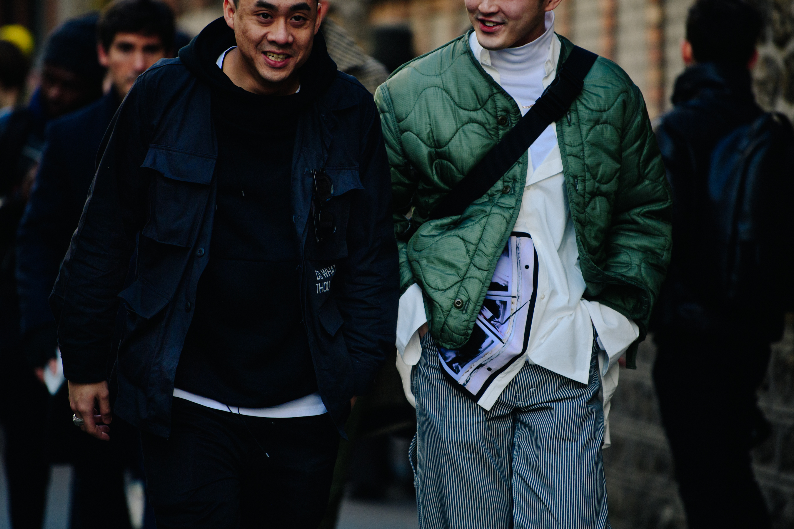 Two Asian men wearing military jackets