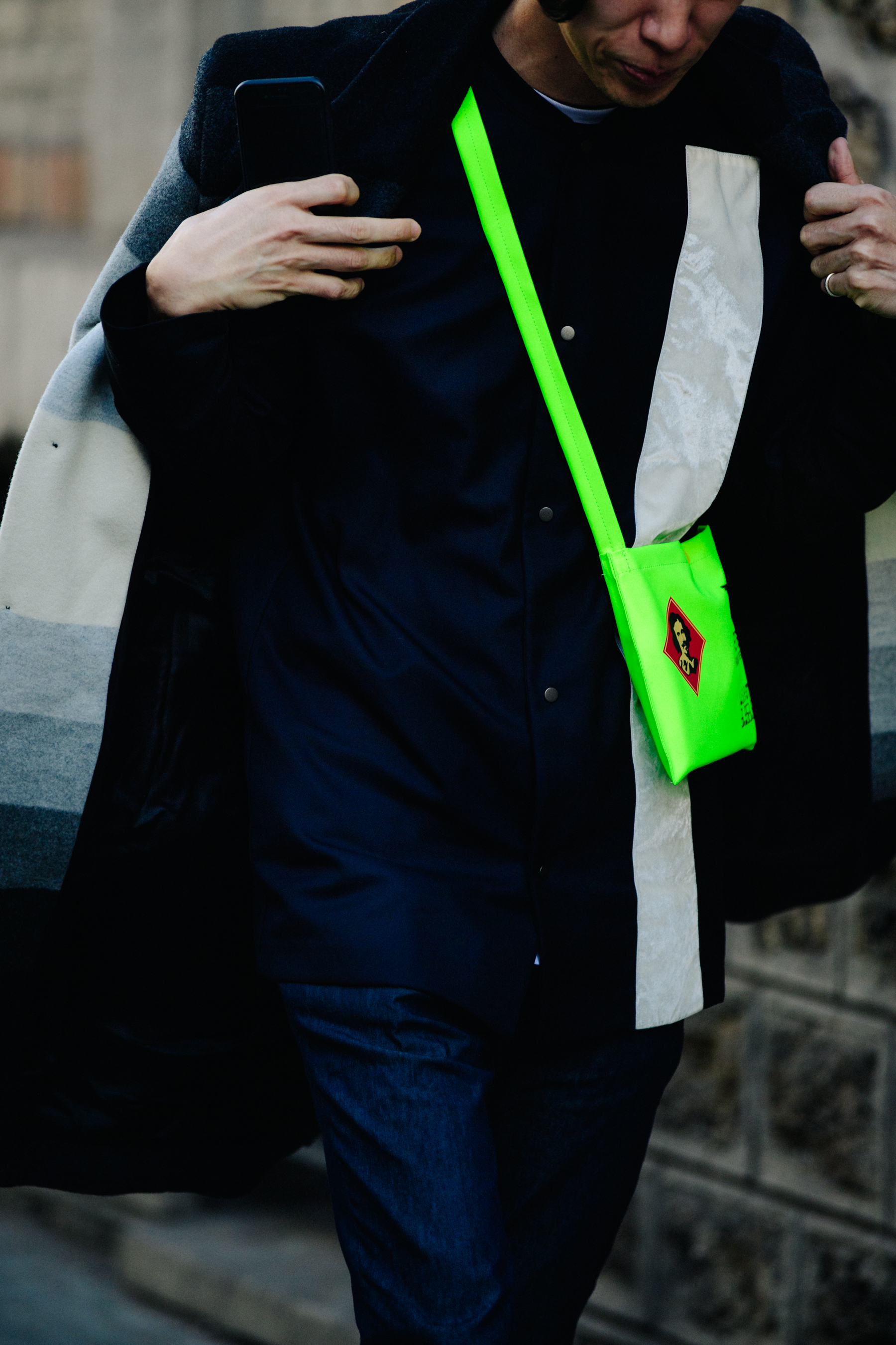 Man wearing green Off-White bag