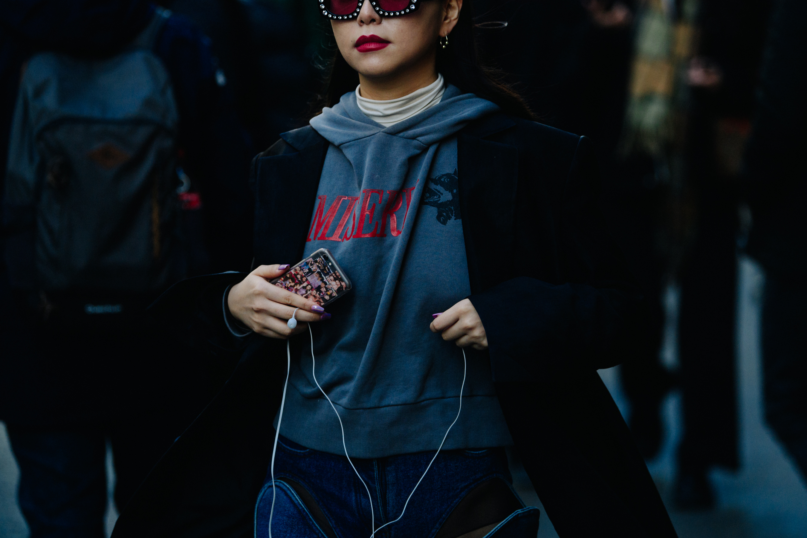 Asian woman wearing Misery hoodie