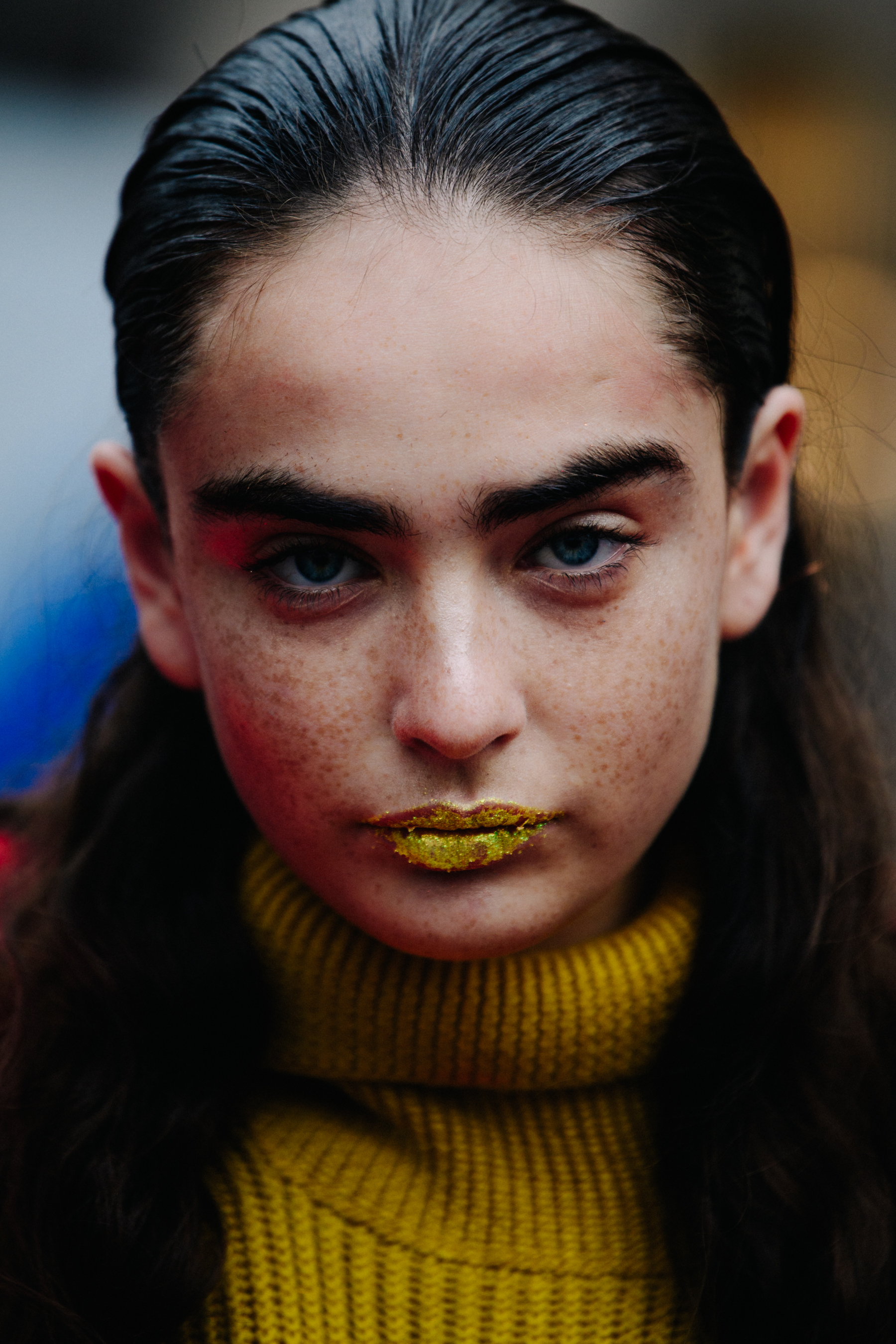 Portrait of Alisha Nesvat wearing yellow glitter