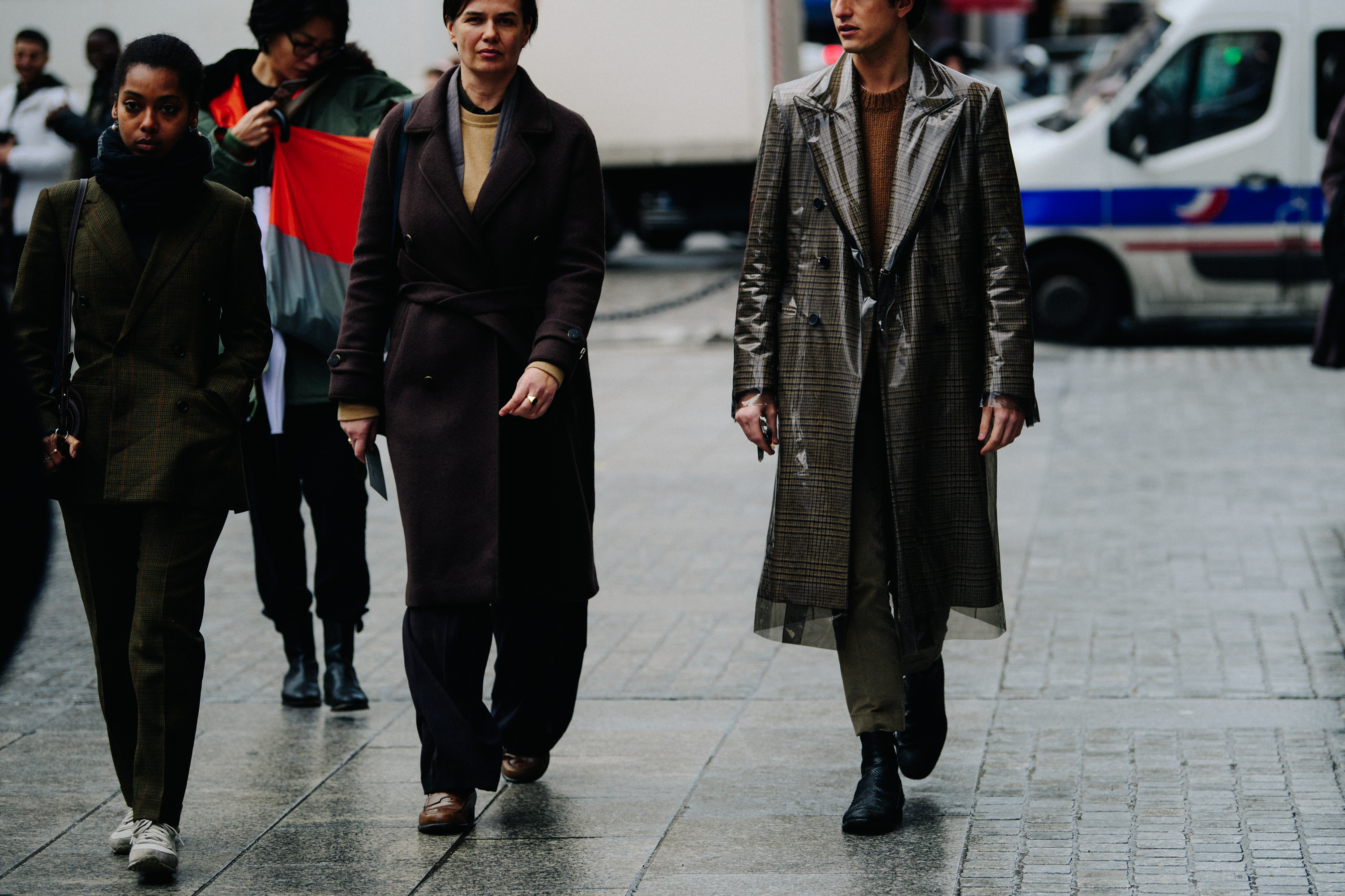 Couple wearing long brown coats