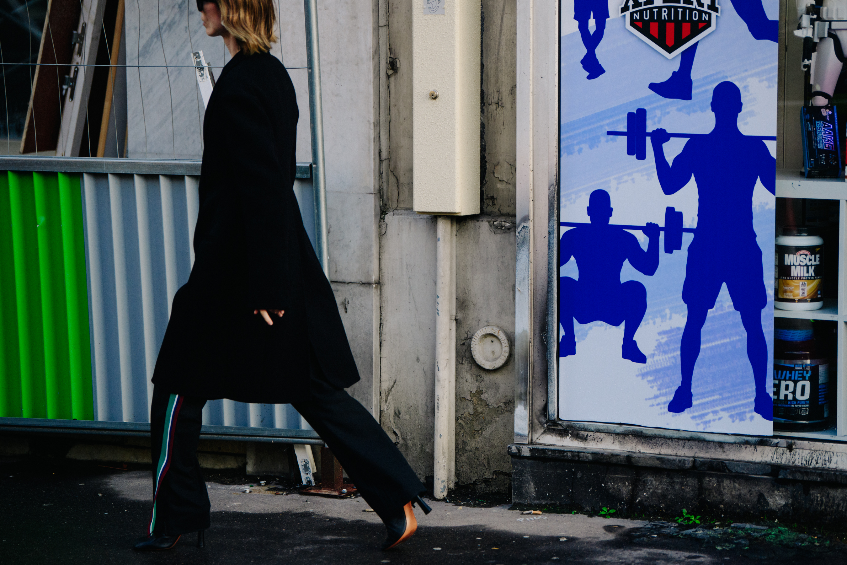 Woman wearing green striped pants