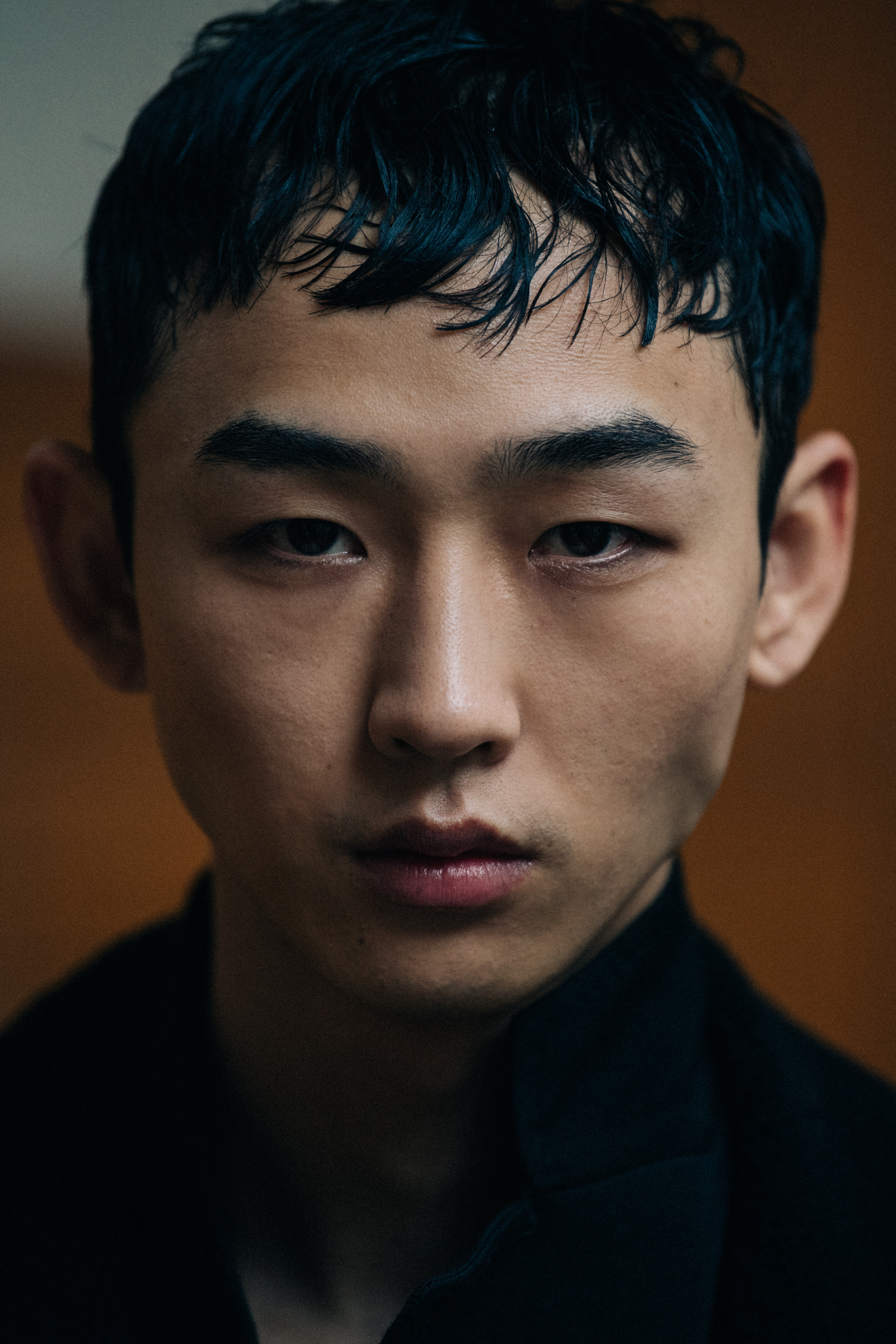 Portrait of Asian model with messy black hair